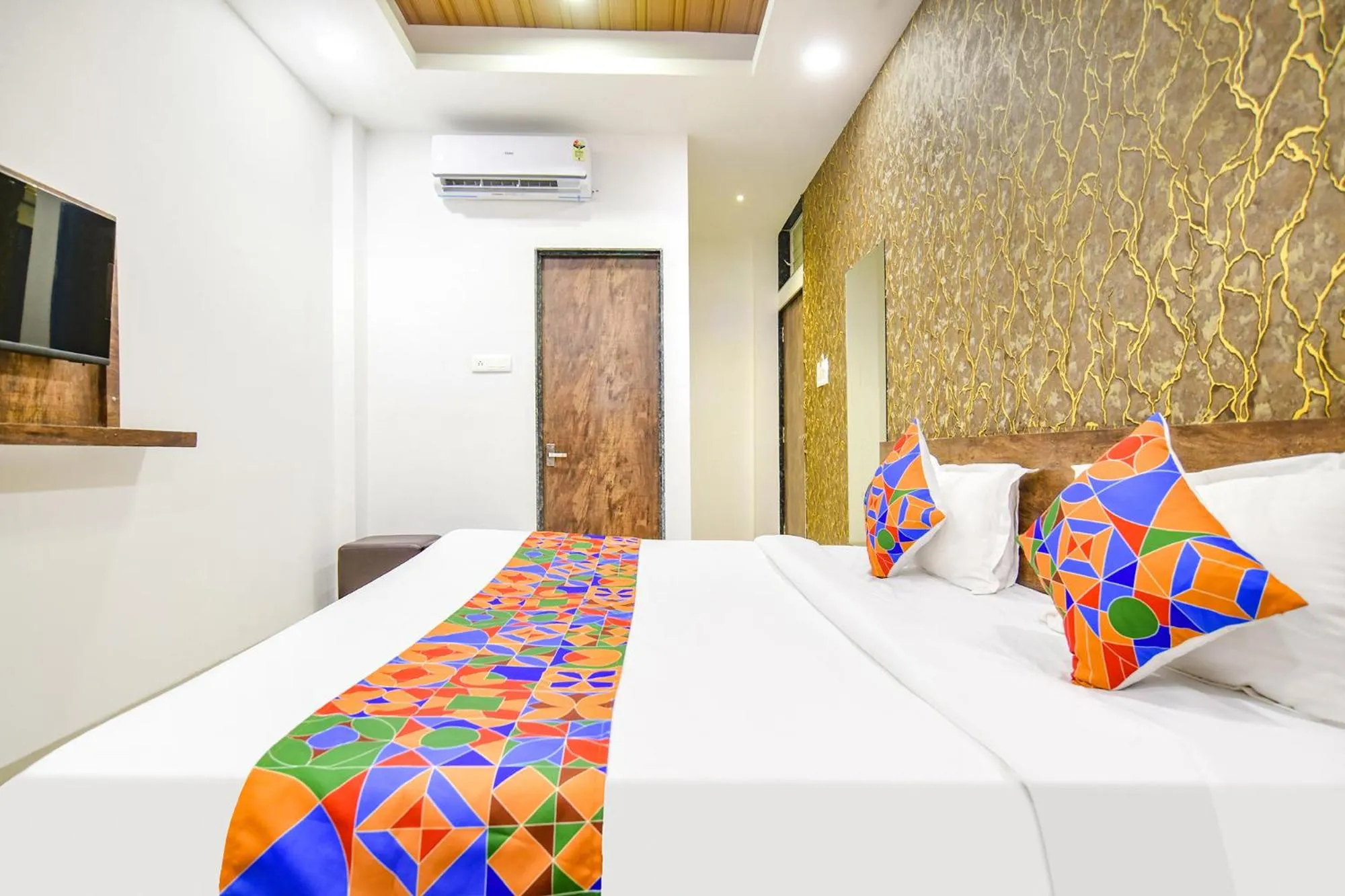 Bed in FabHotel Sage Residency