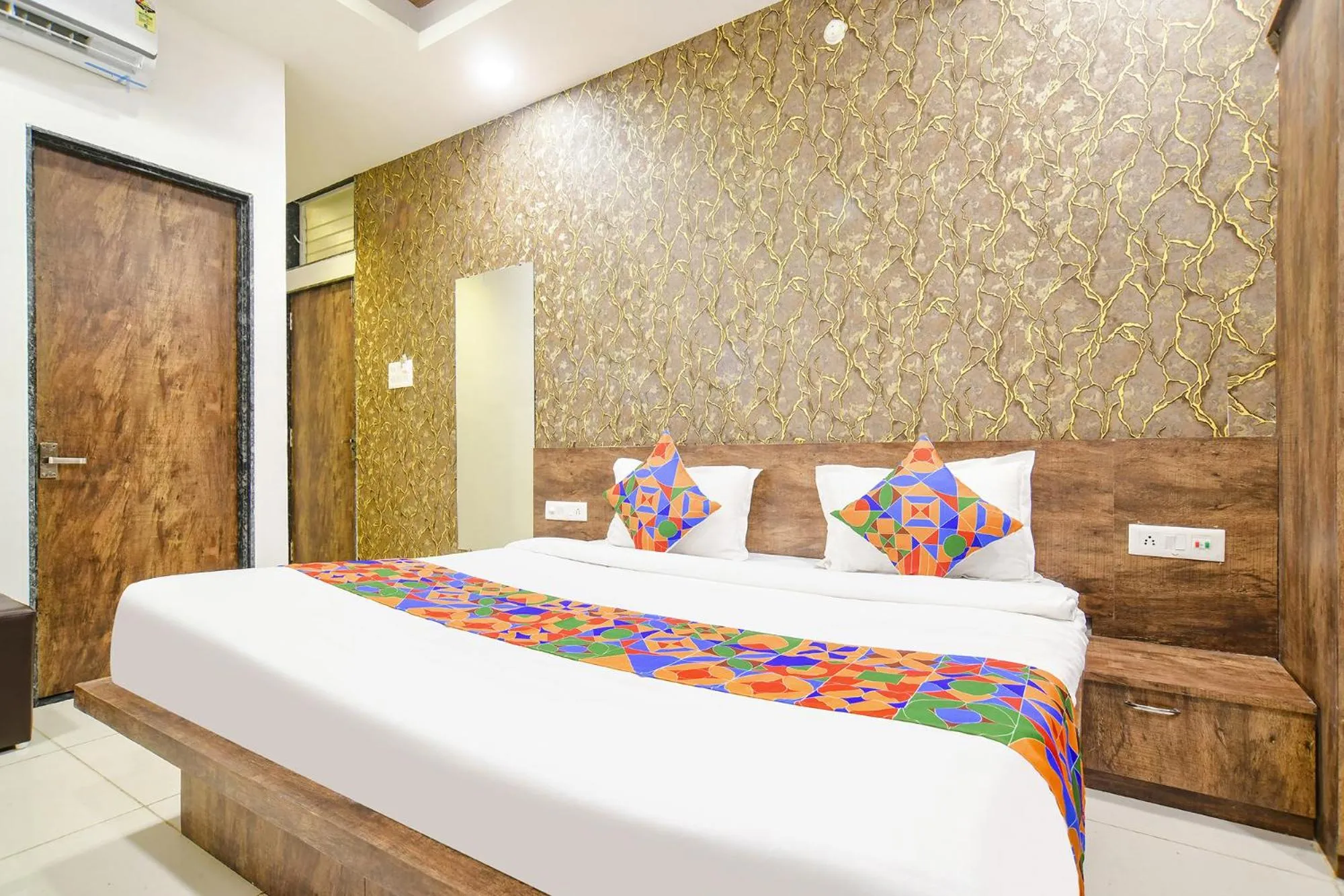 Bed in FabHotel Sage Residency