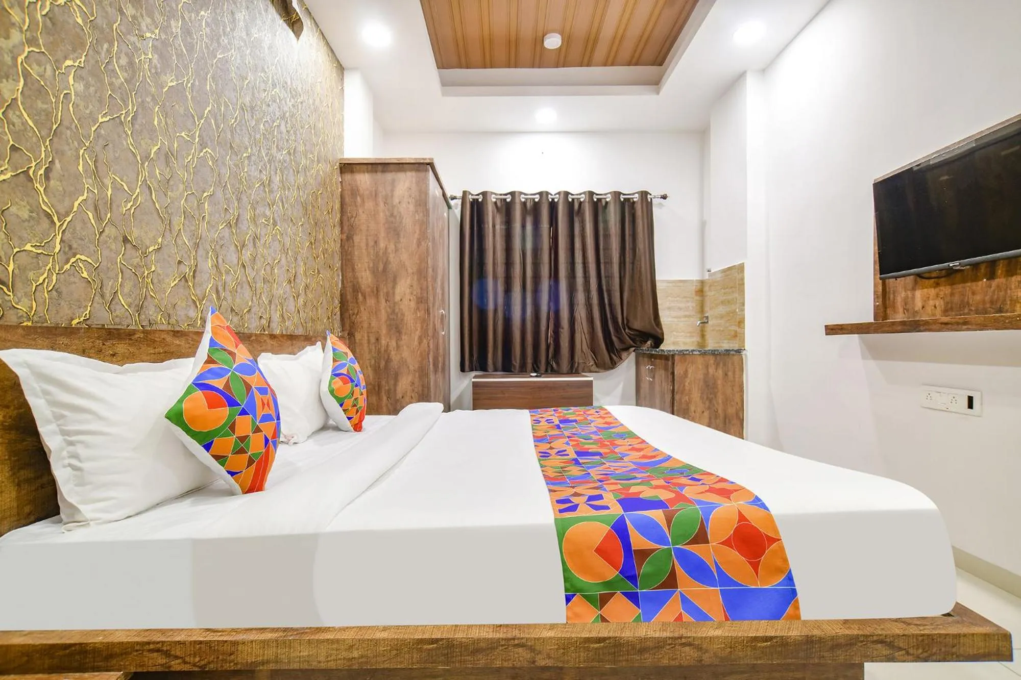 Bed in FabHotel Sage Residency