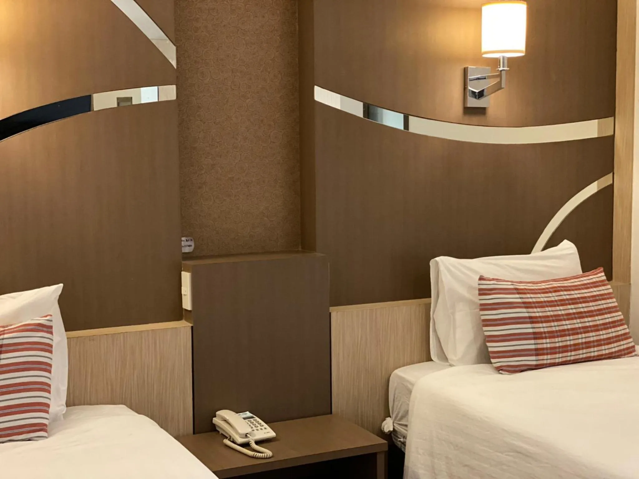 Bed in Delio Boutique Hotel