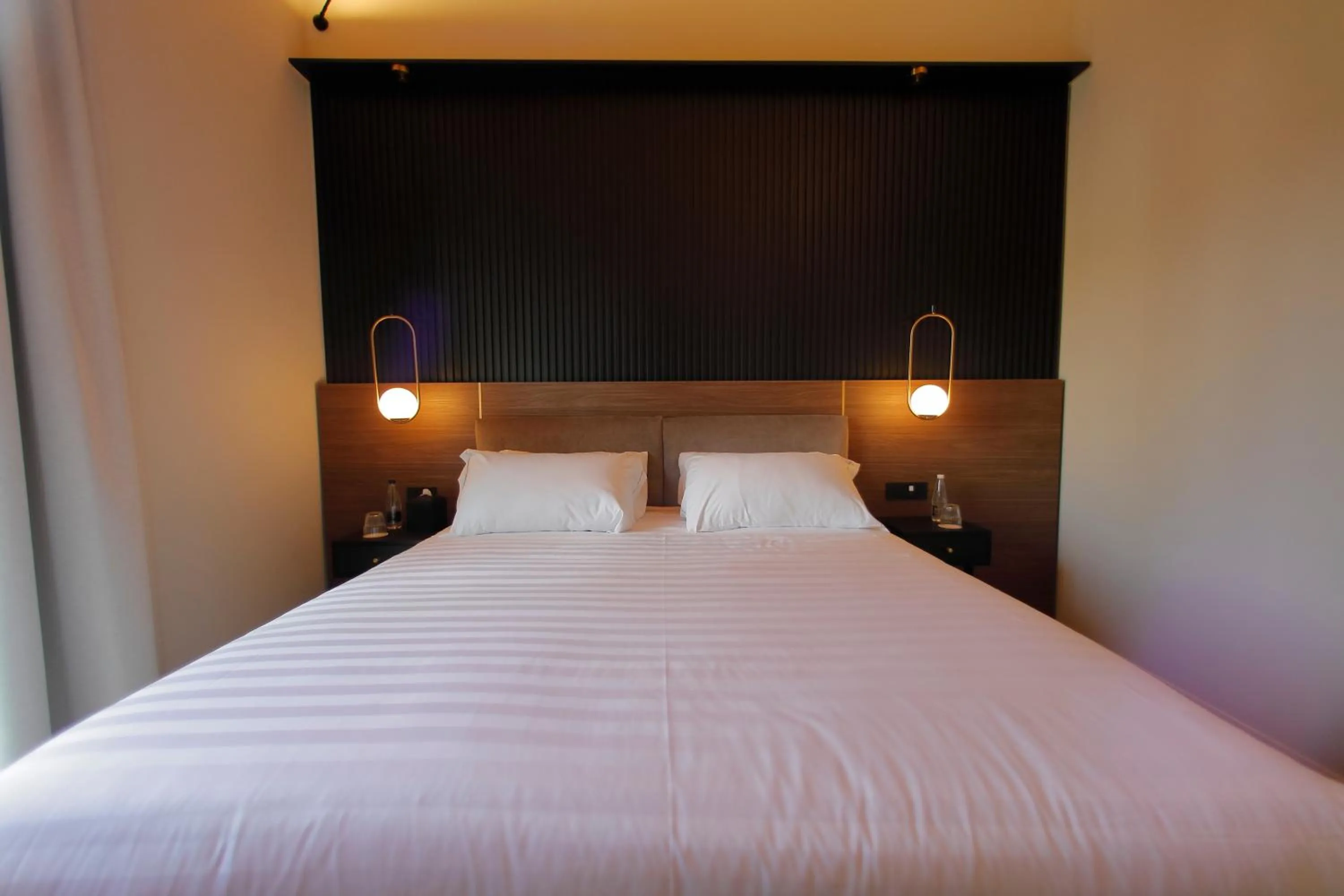 Bed in Hotel Namia by Dori