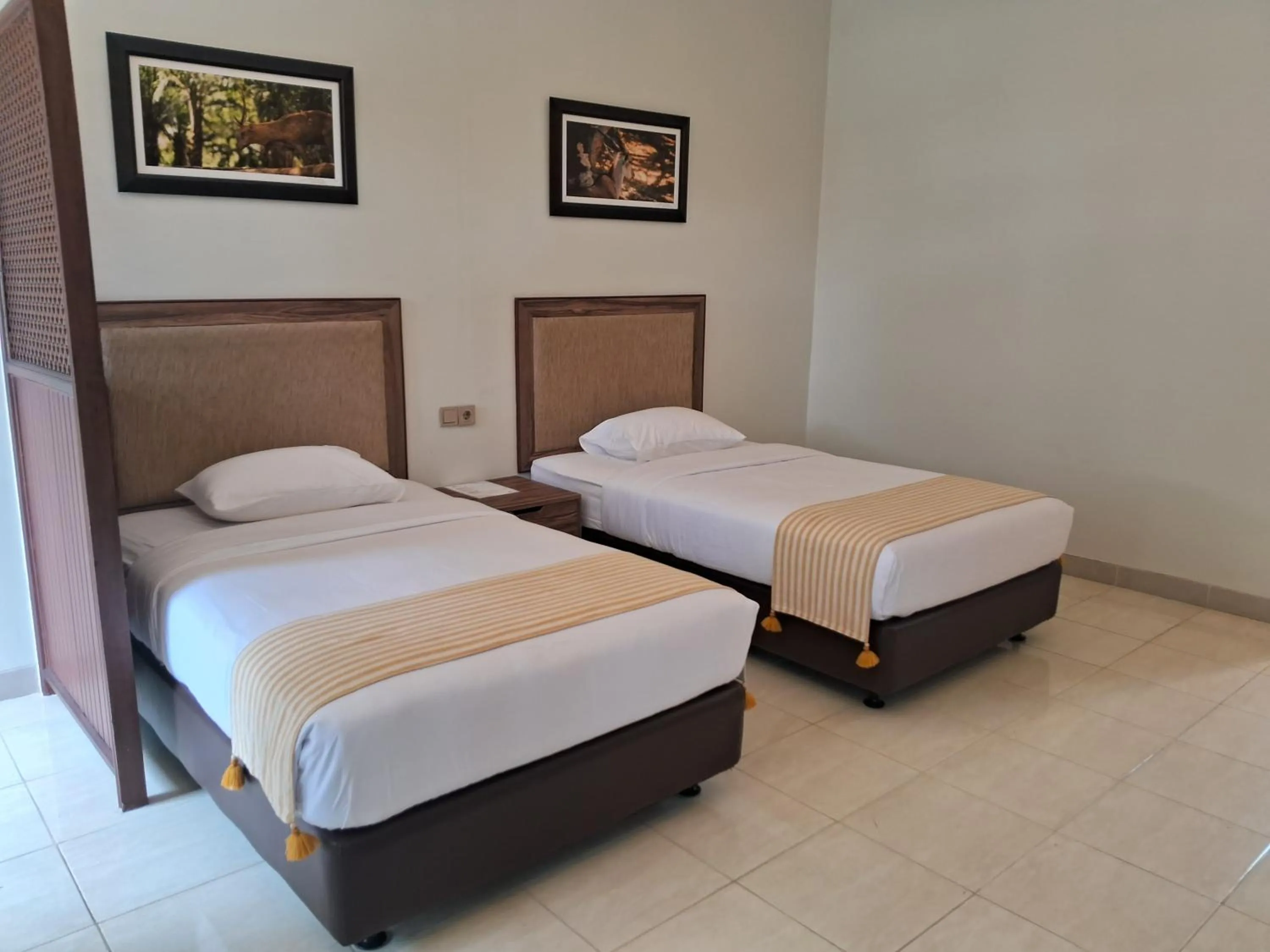 Bed in INDO ALAM RECREATIONAL RESORT