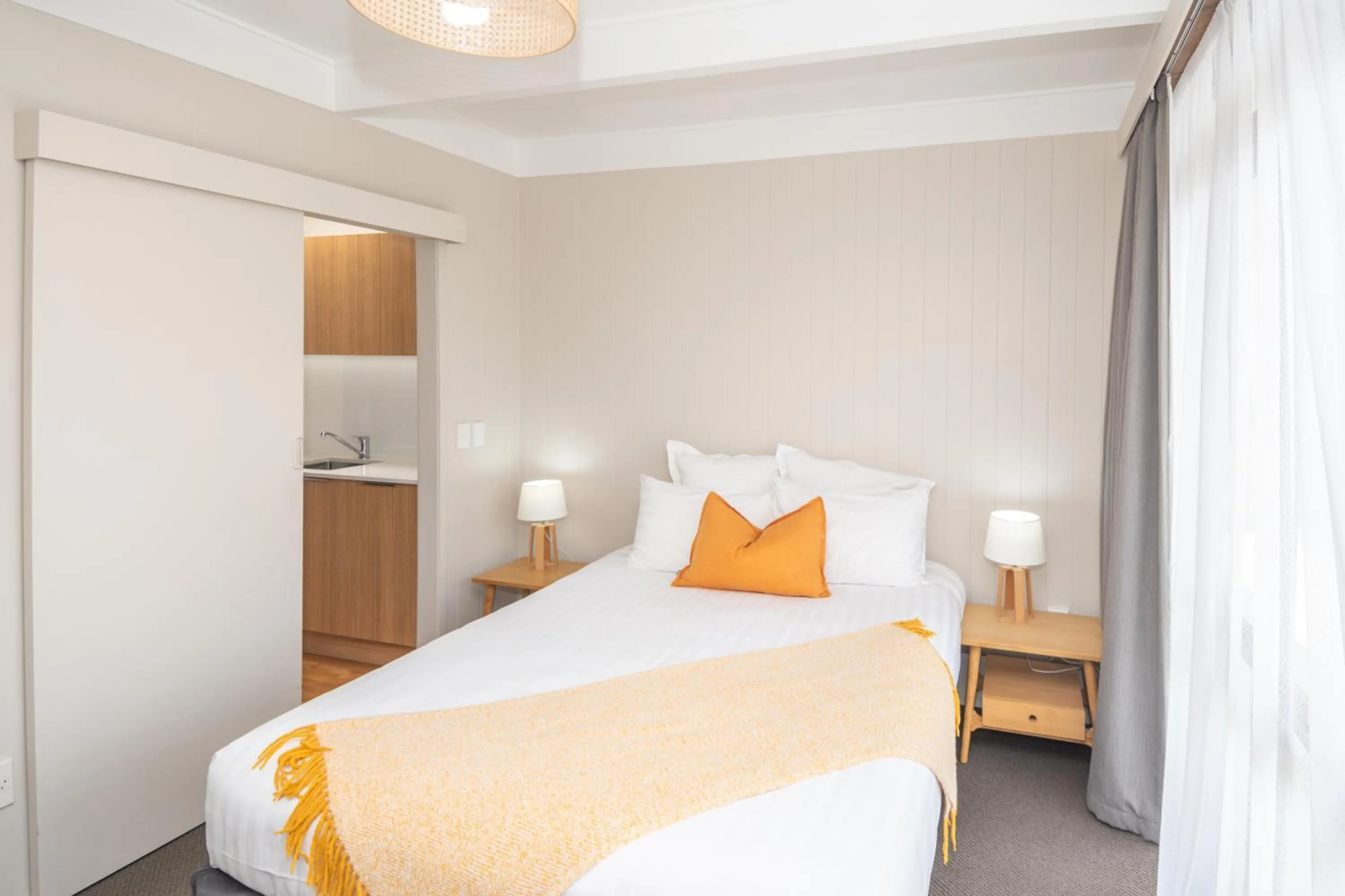 Bed in Whispering Sands Beachfront Motel