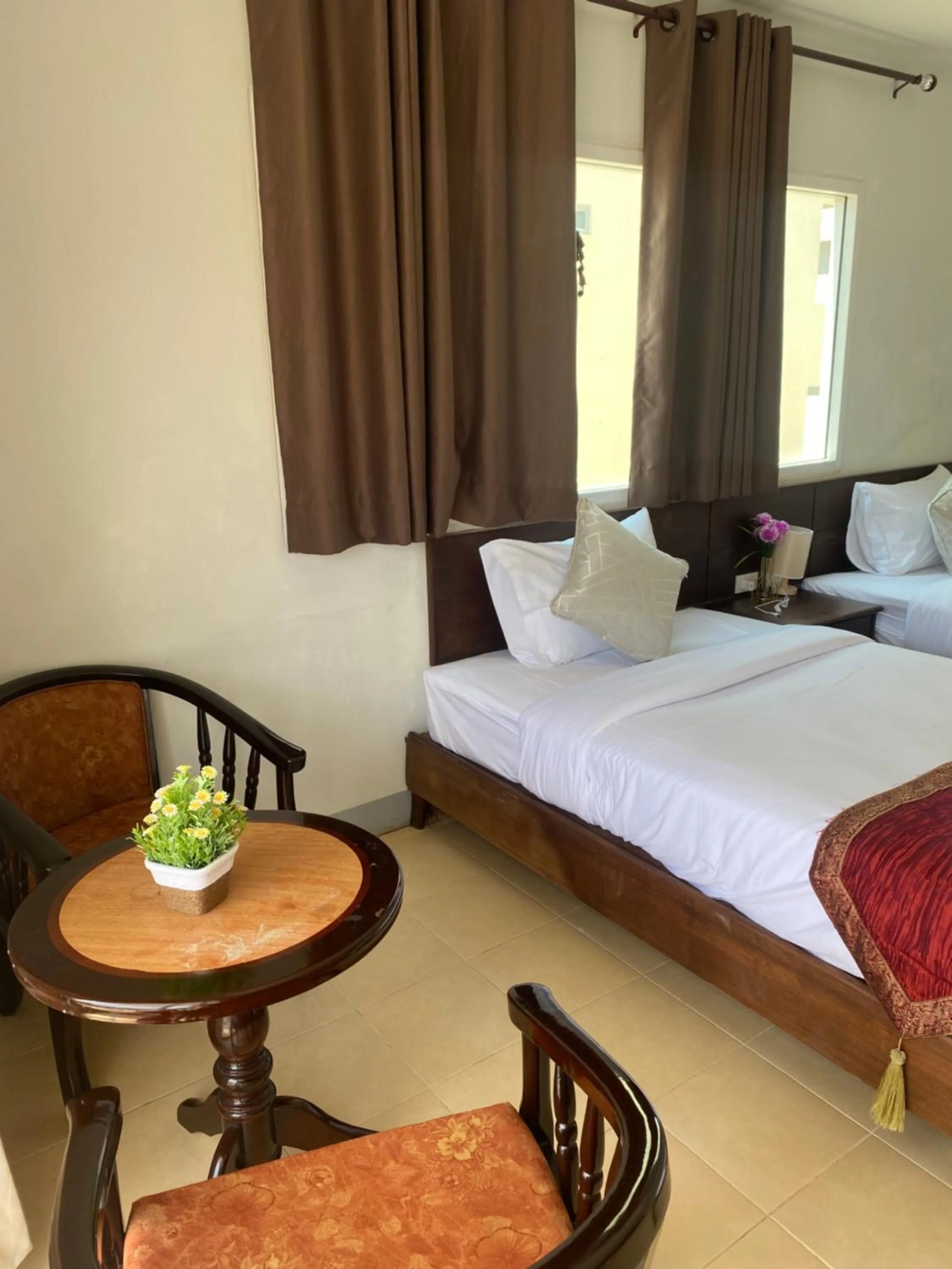 Bed in NAKA GUEST HOUSE