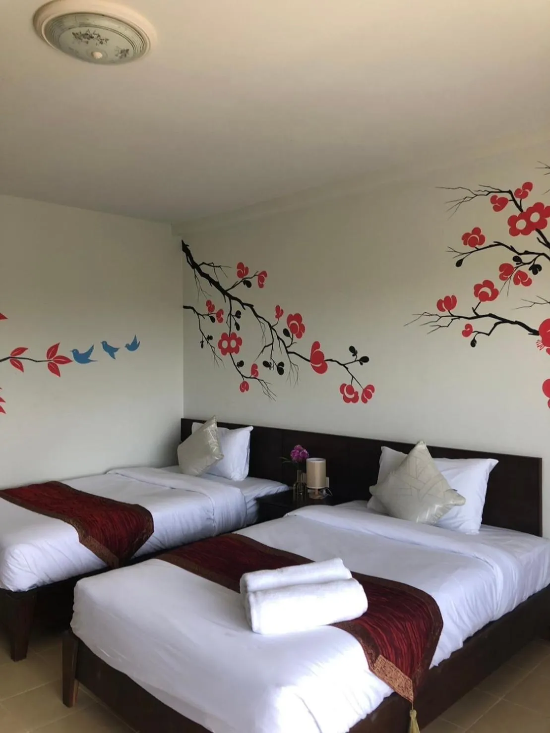 Bed in NAKA GUEST HOUSE