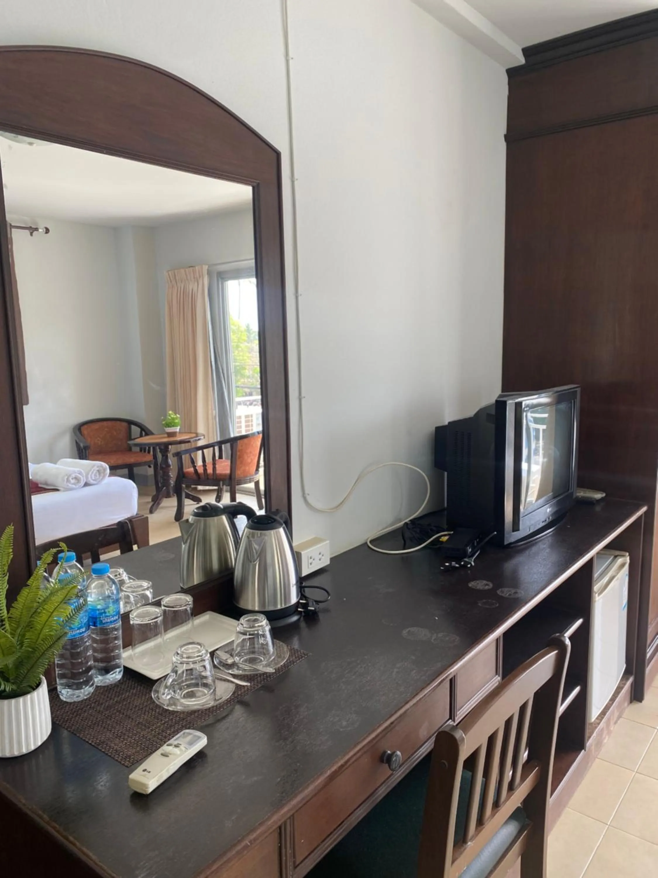 Bed in NAKA GUEST HOUSE