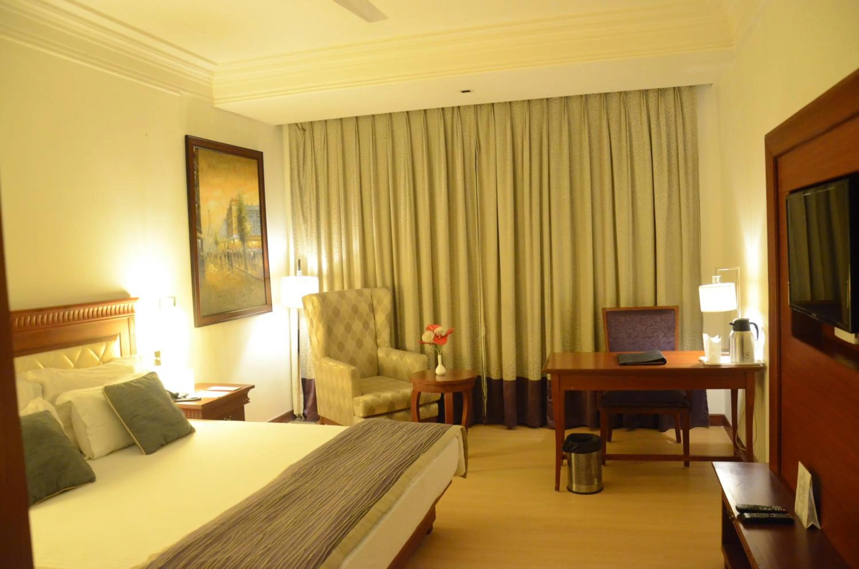 Bed in Chanakya Bnr Hotel