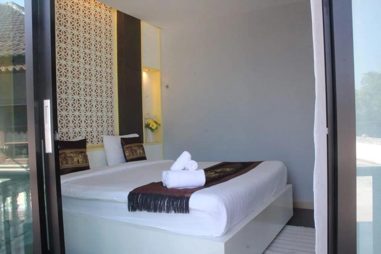 Bed in Saranya River House สรัญญาริเวอร์เฮาส์