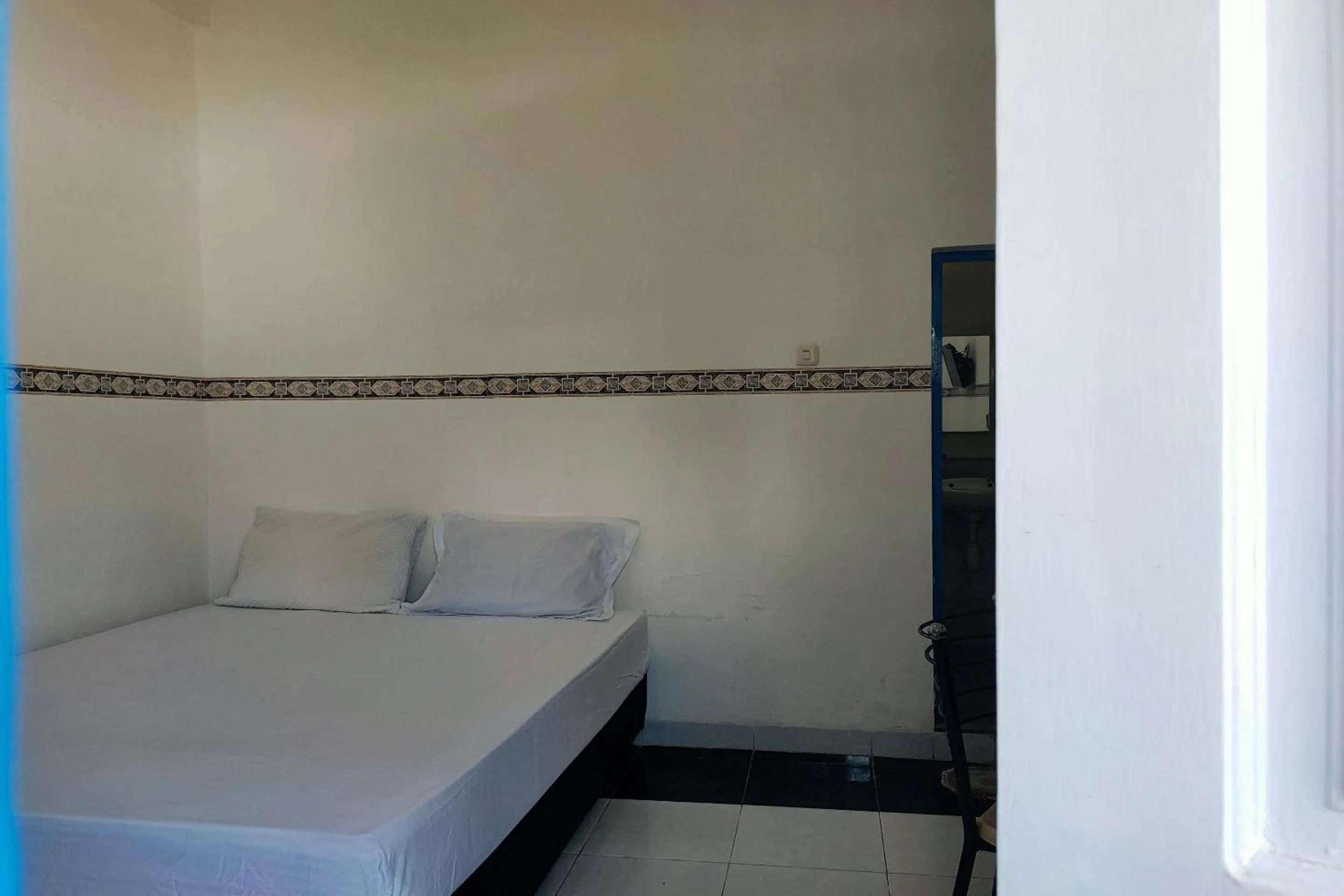 Bedroom in Hotel O Pondok Baruga 777 Near Sarewo Musik Studio Kendari