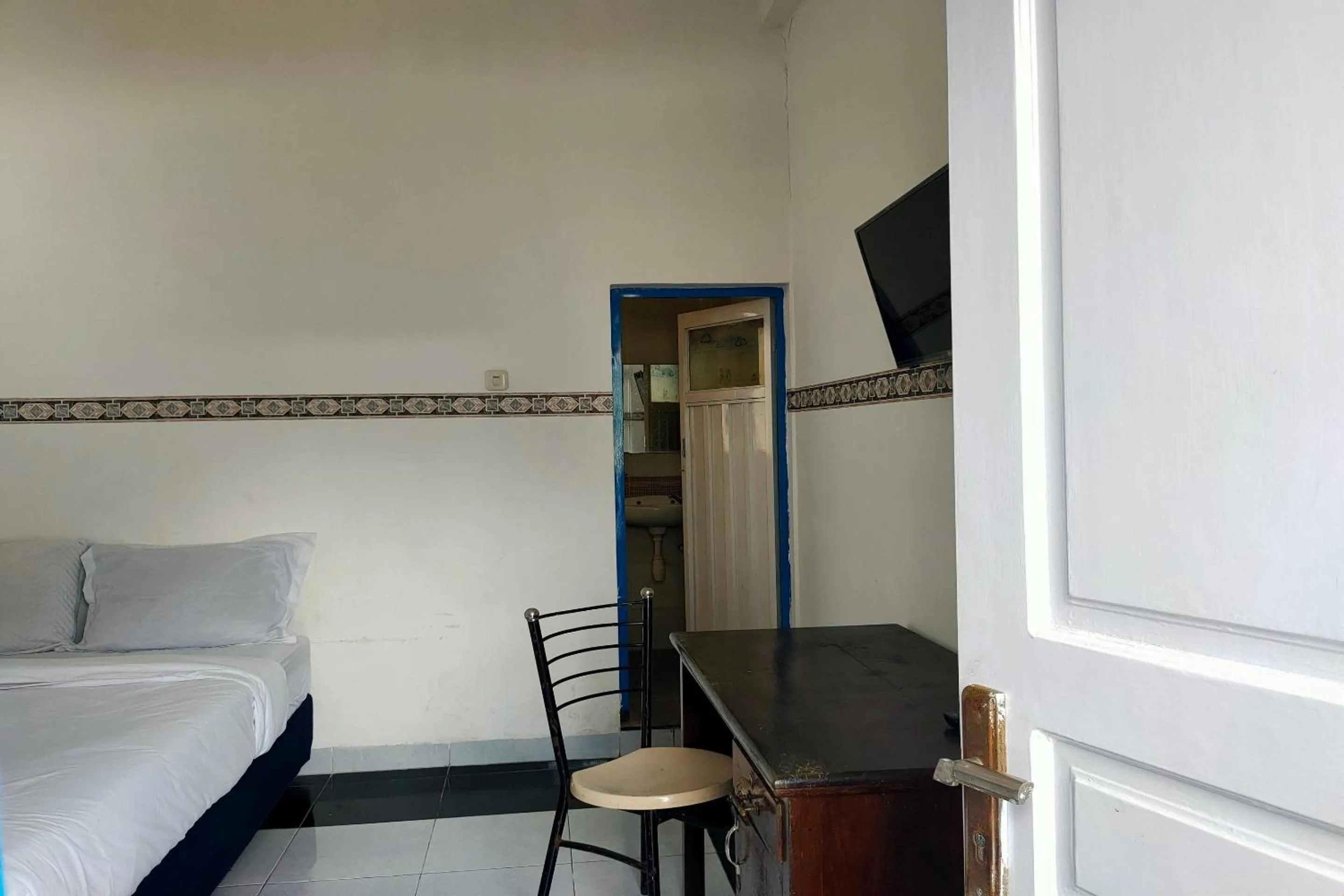 Bedroom in Hotel O Pondok Baruga 777 Near Sarewo Musik Studio Kendari