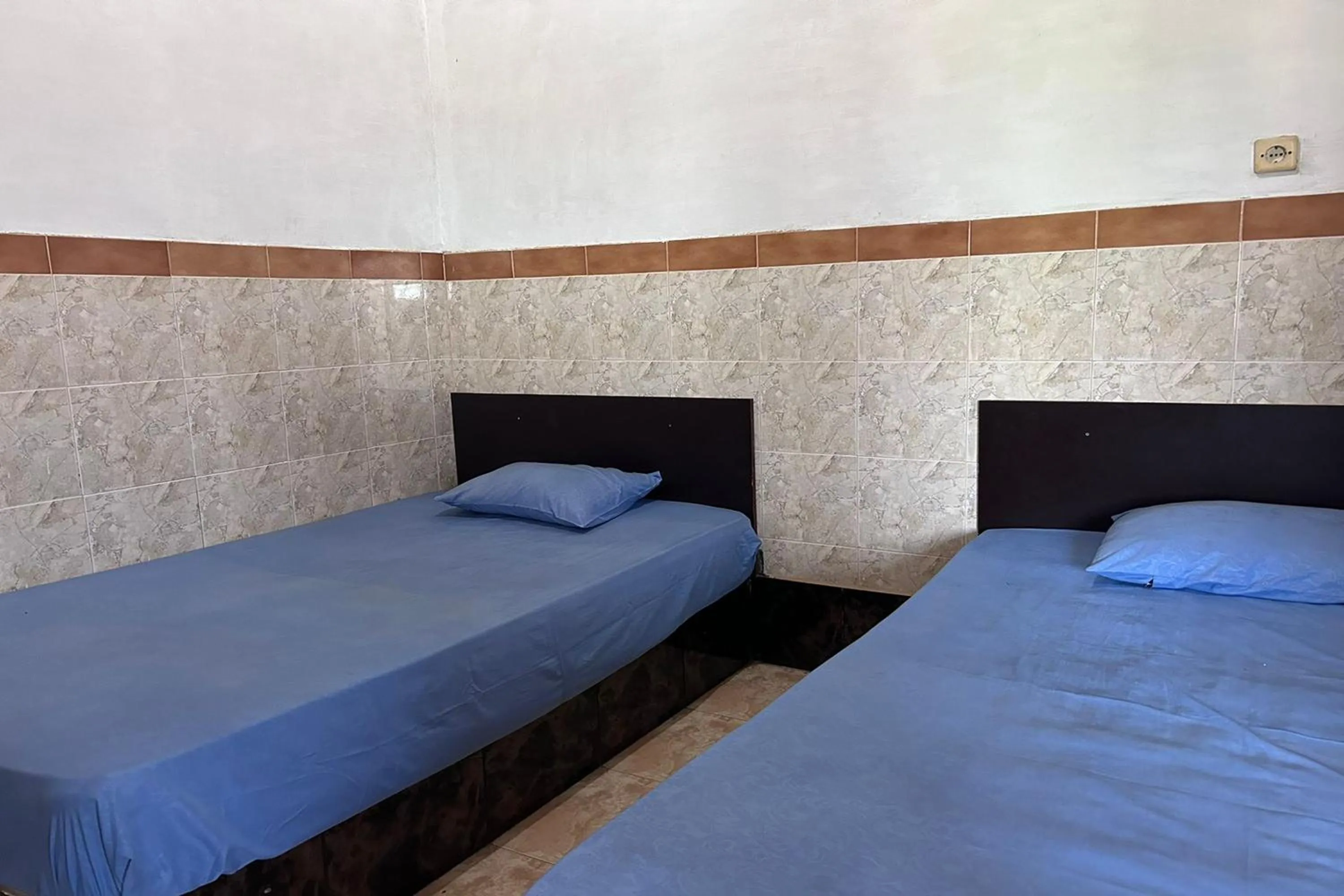 Bed in Hotel Kinasih Yogyakarta