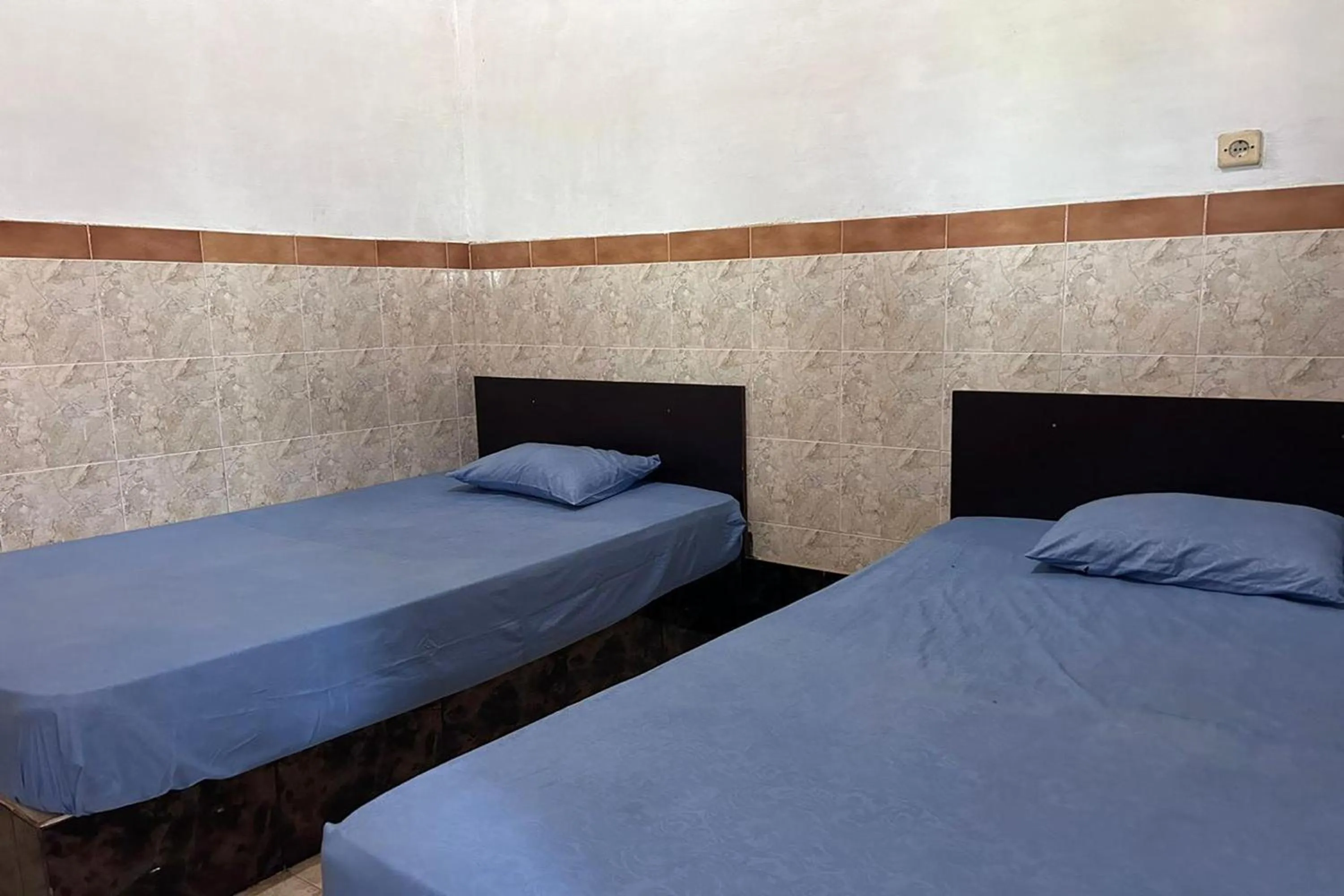 Bed in Hotel Kinasih Yogyakarta