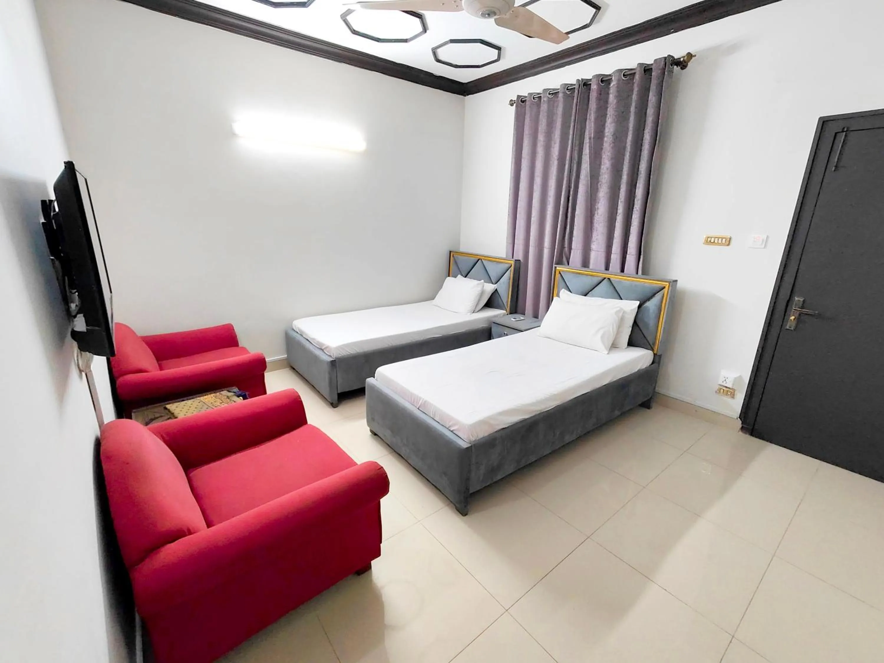 Bed in Aleph Islamabad Guest House