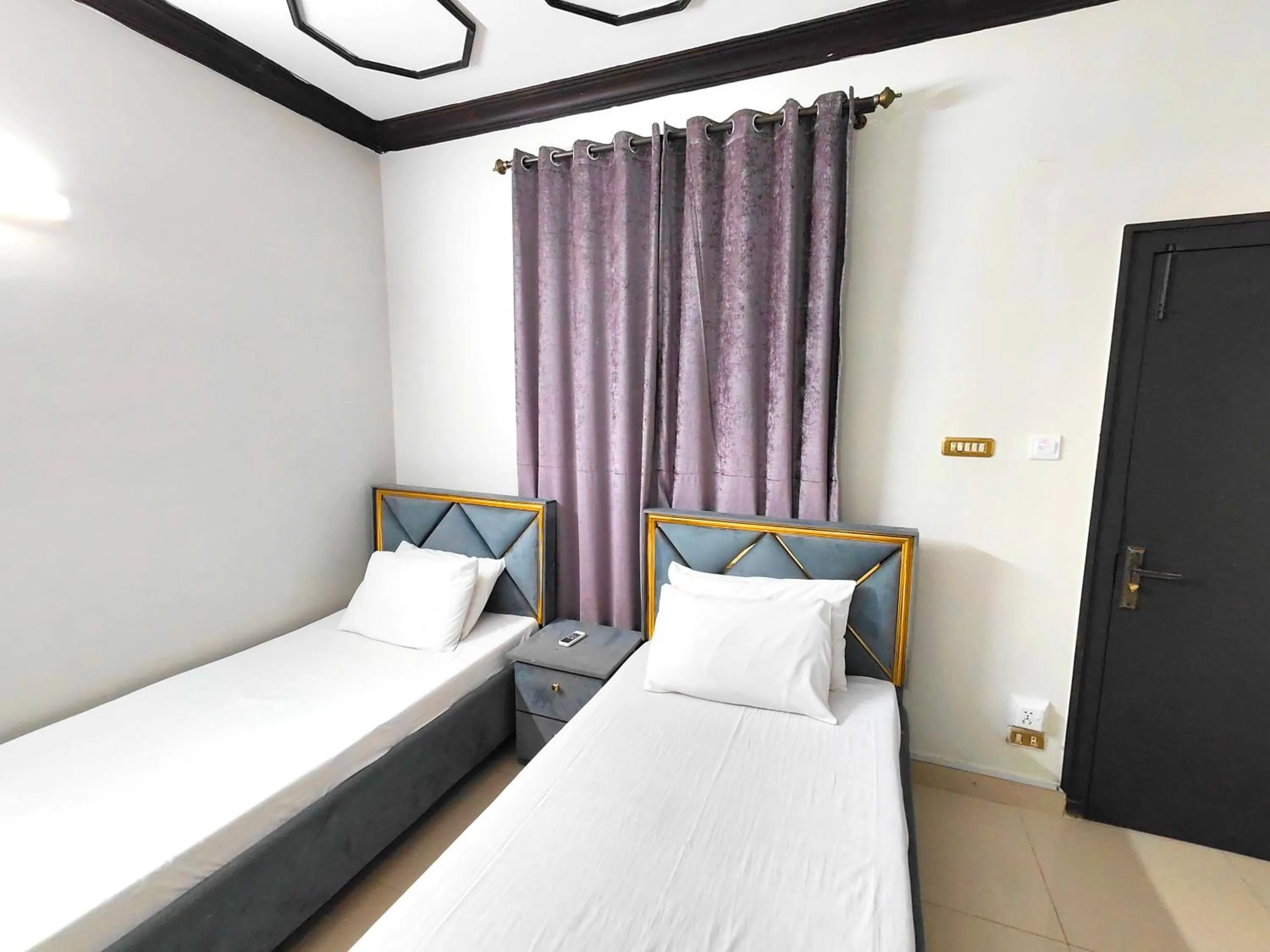 Bed in Aleph Islamabad Guest House