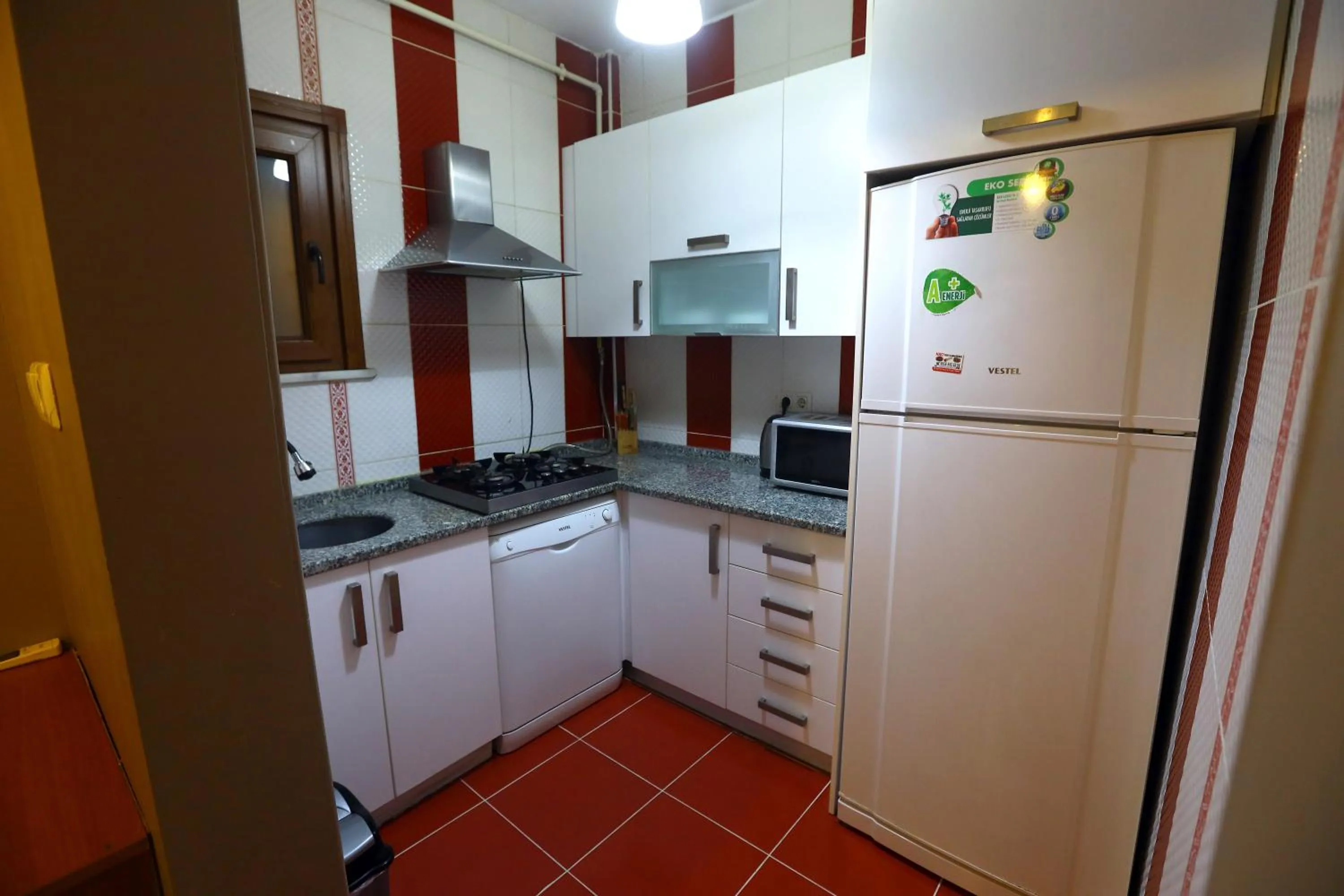 kitchen in Zendy Suite Hotel