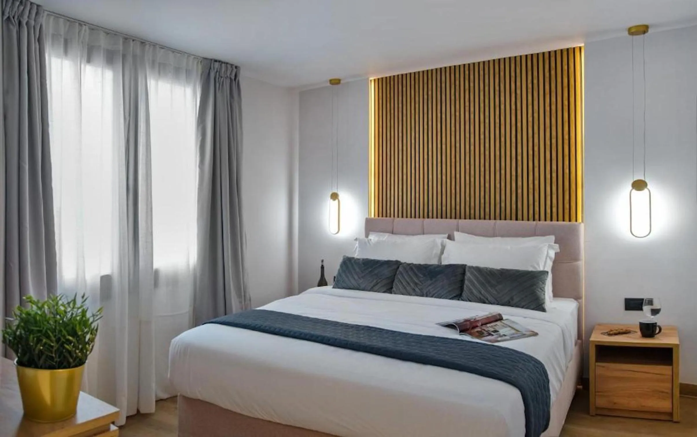 Bed in CITYLUXE Suites & Rooms