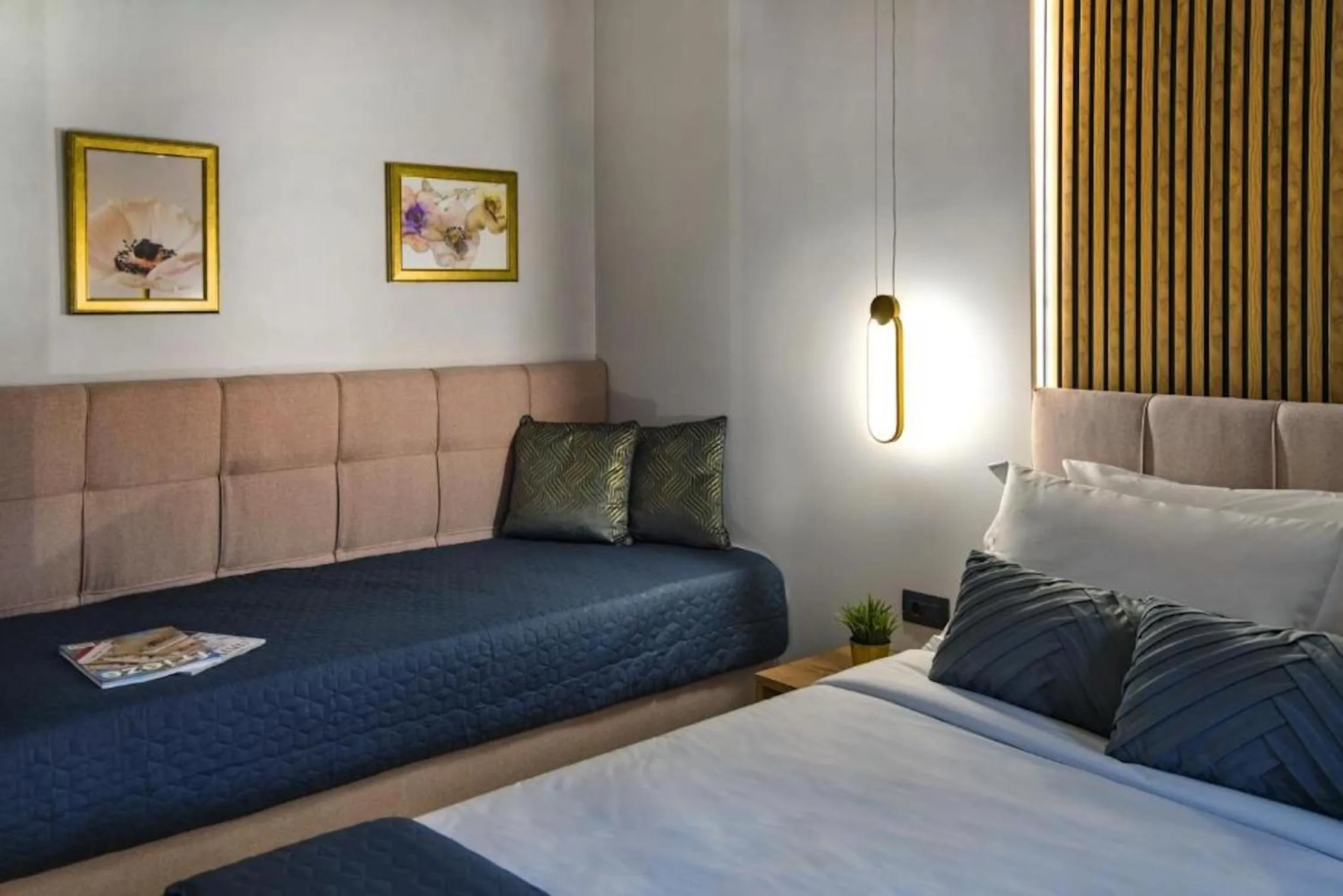 Bed in CITYLUXE Suites & Rooms