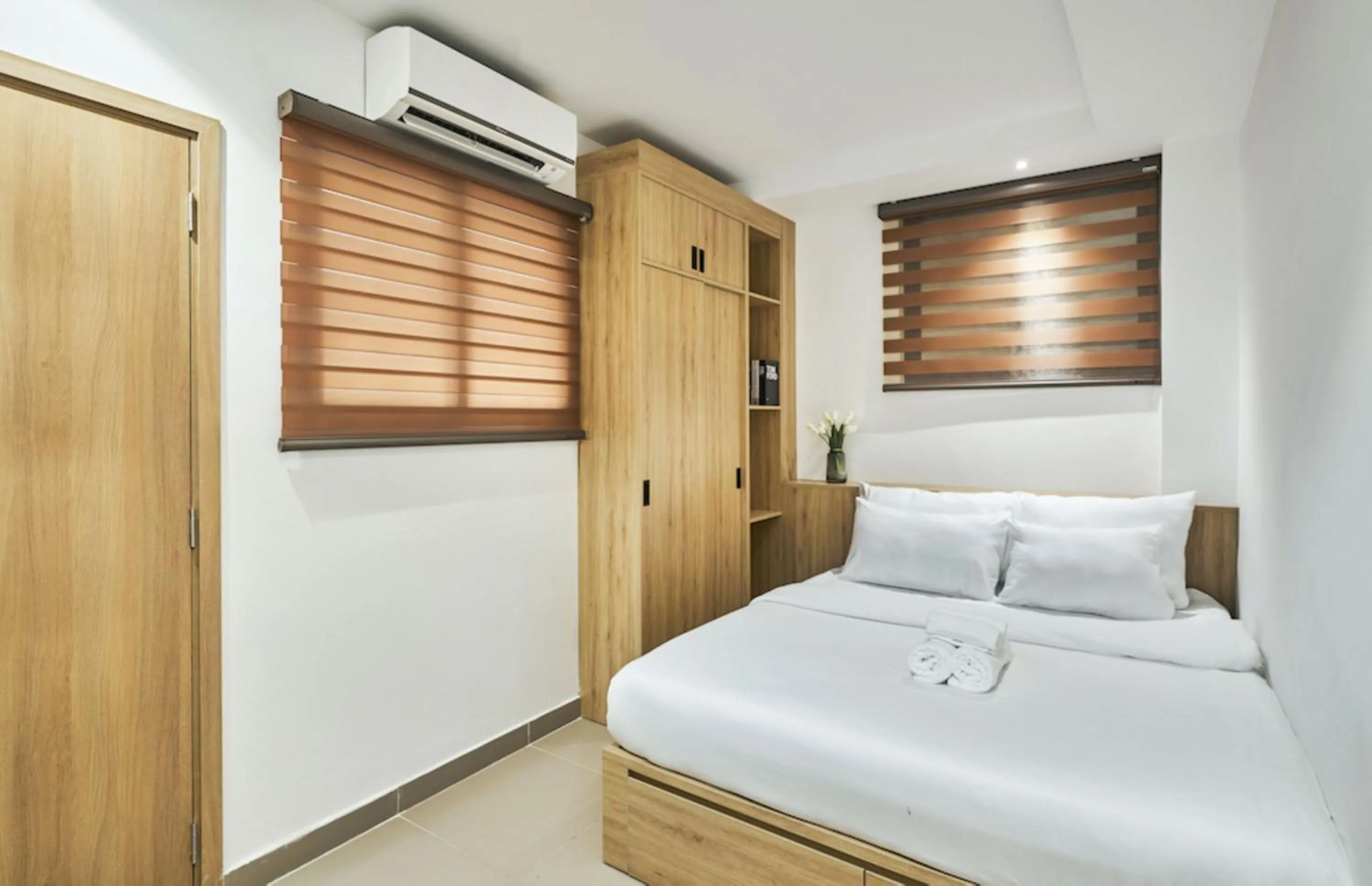 Bed in MIHN SUITES BEN THANH