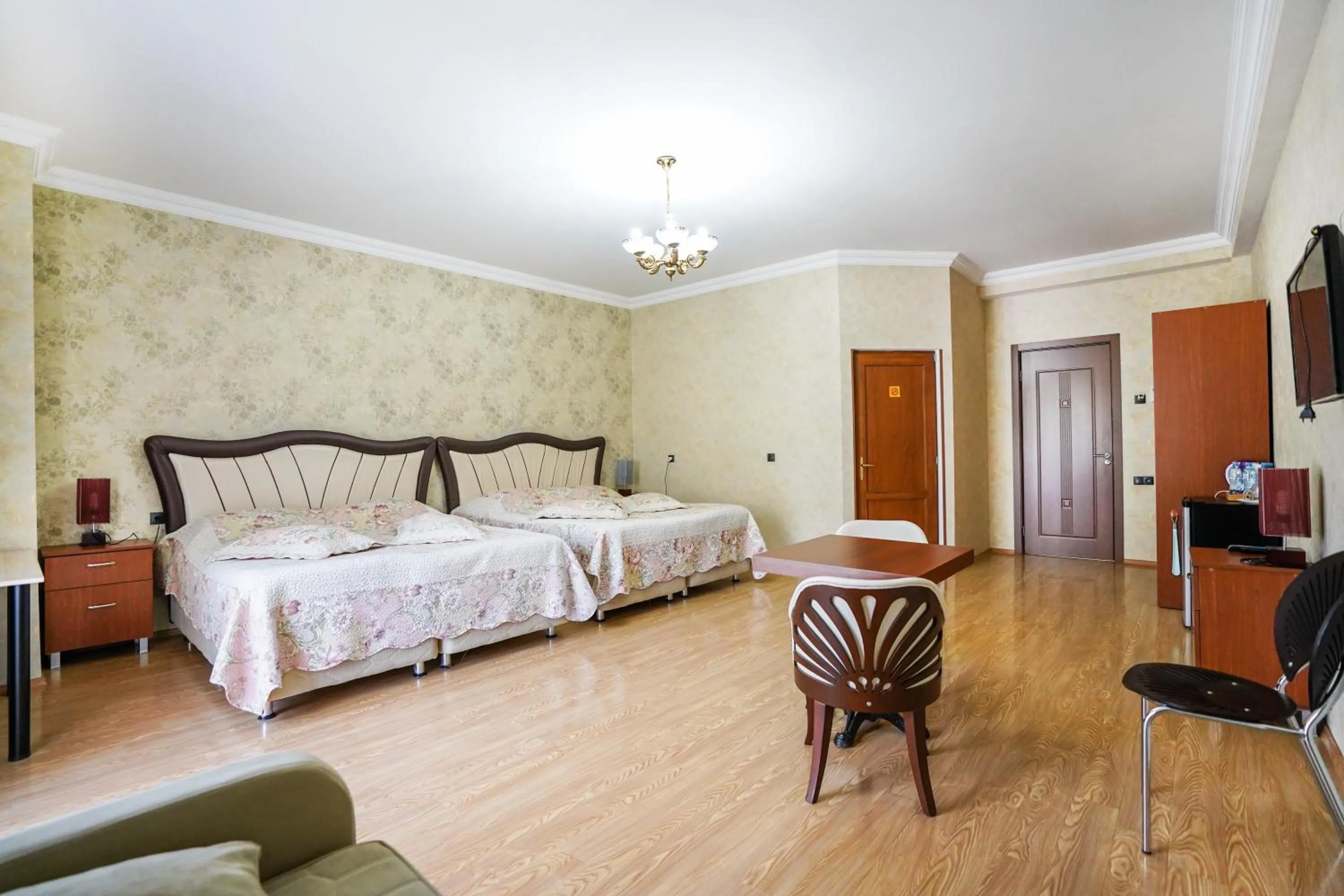 Communal lounge/ TV room, Bed in Natali Hotel