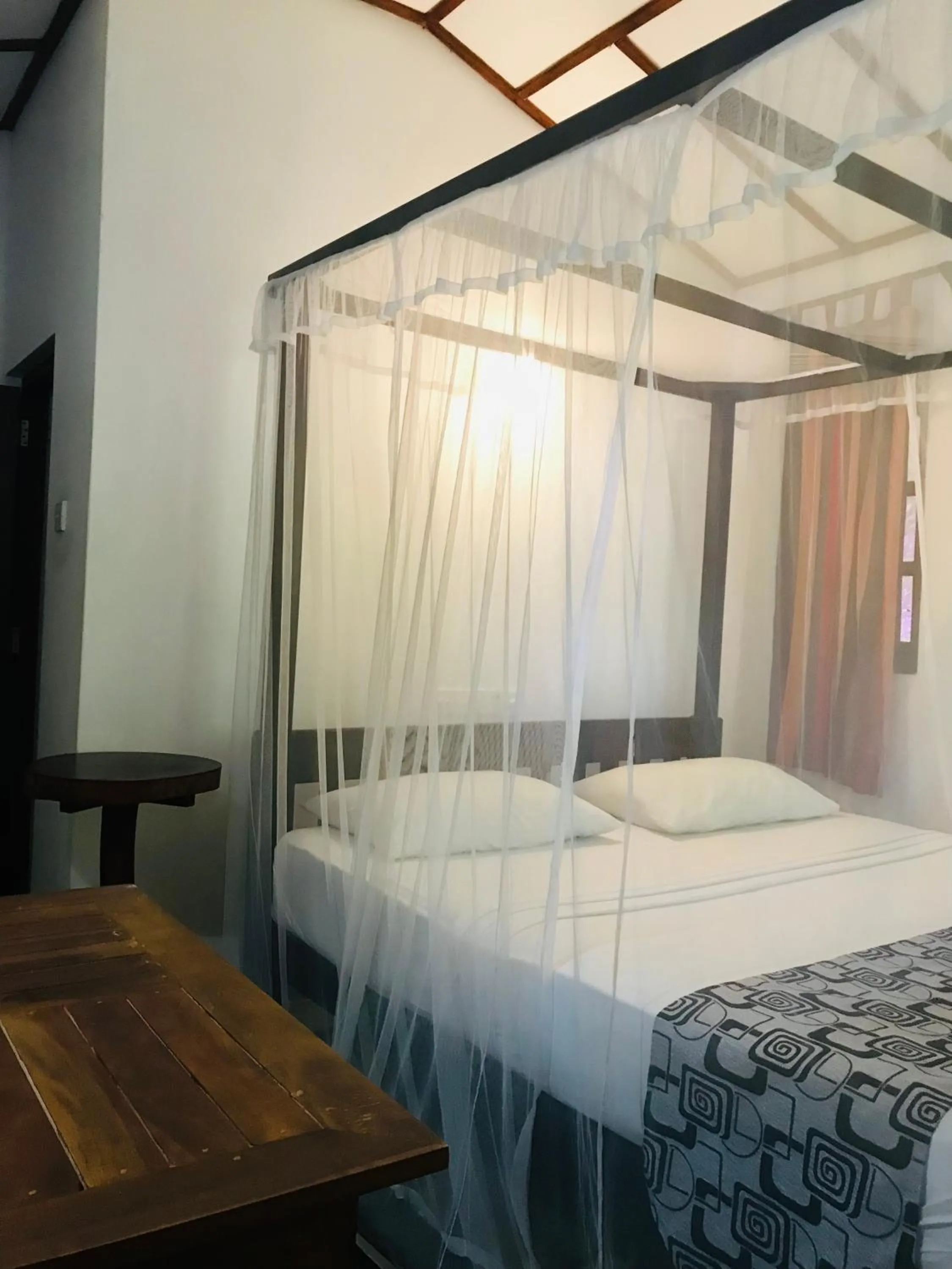 Bed in Ganesh Garden Beach Cabanas