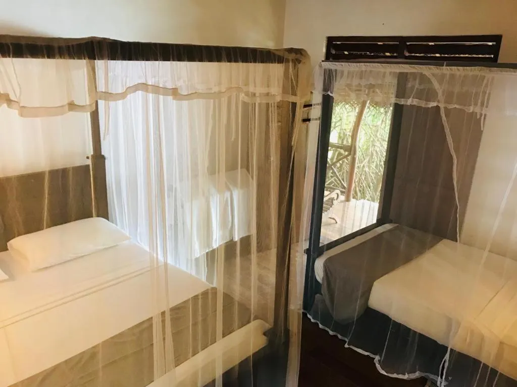 Bed in Ganesh Garden Beach Cabanas