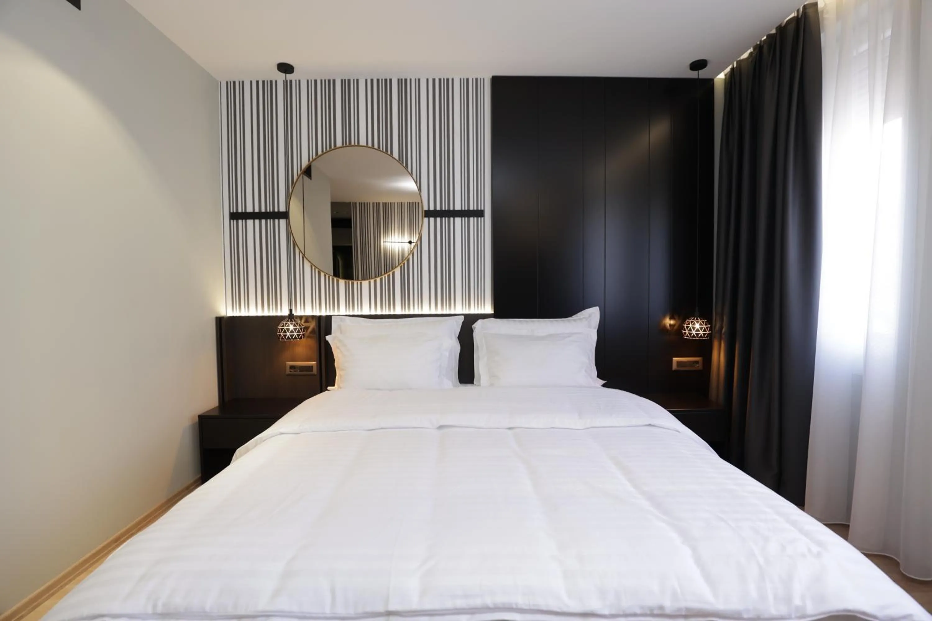 Bed in Gremmy Boutique Hotel