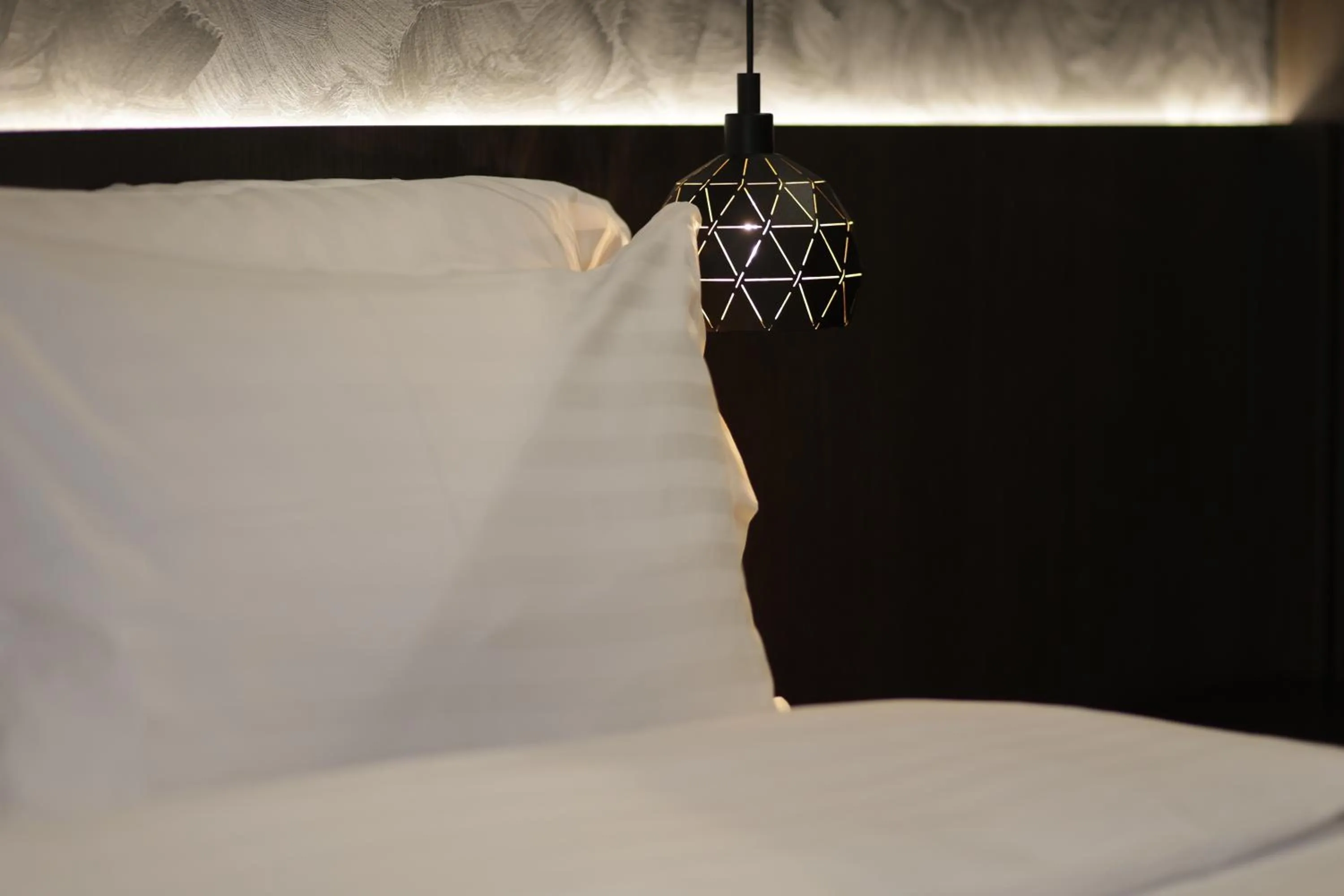 Bed in Gremmy Boutique Hotel