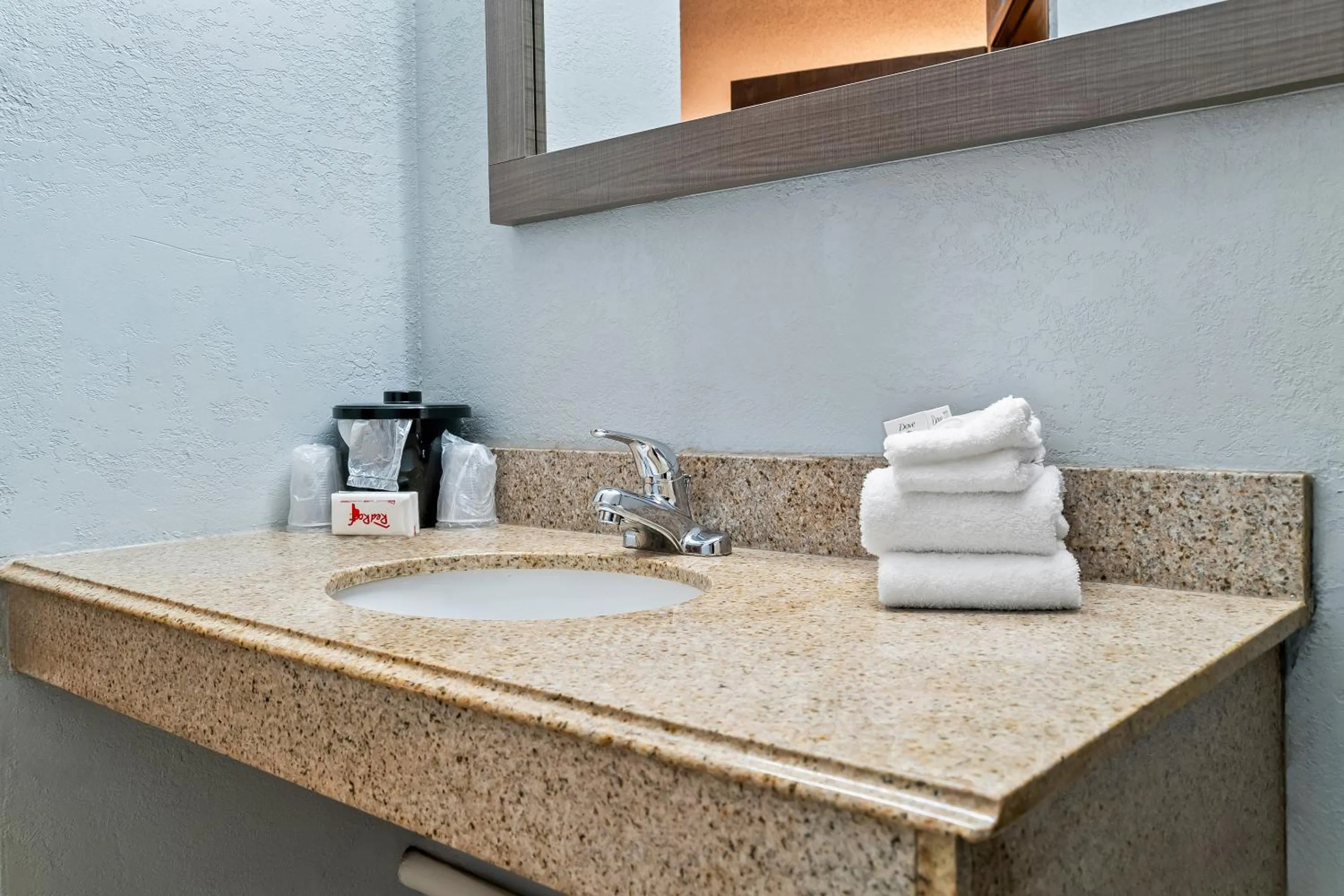 Bathroom in HomeTowne Studios by Red Roof Flint