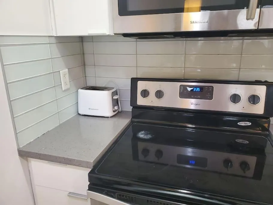 stove in Stunning 1 bedroom condo in Calgary with riverview