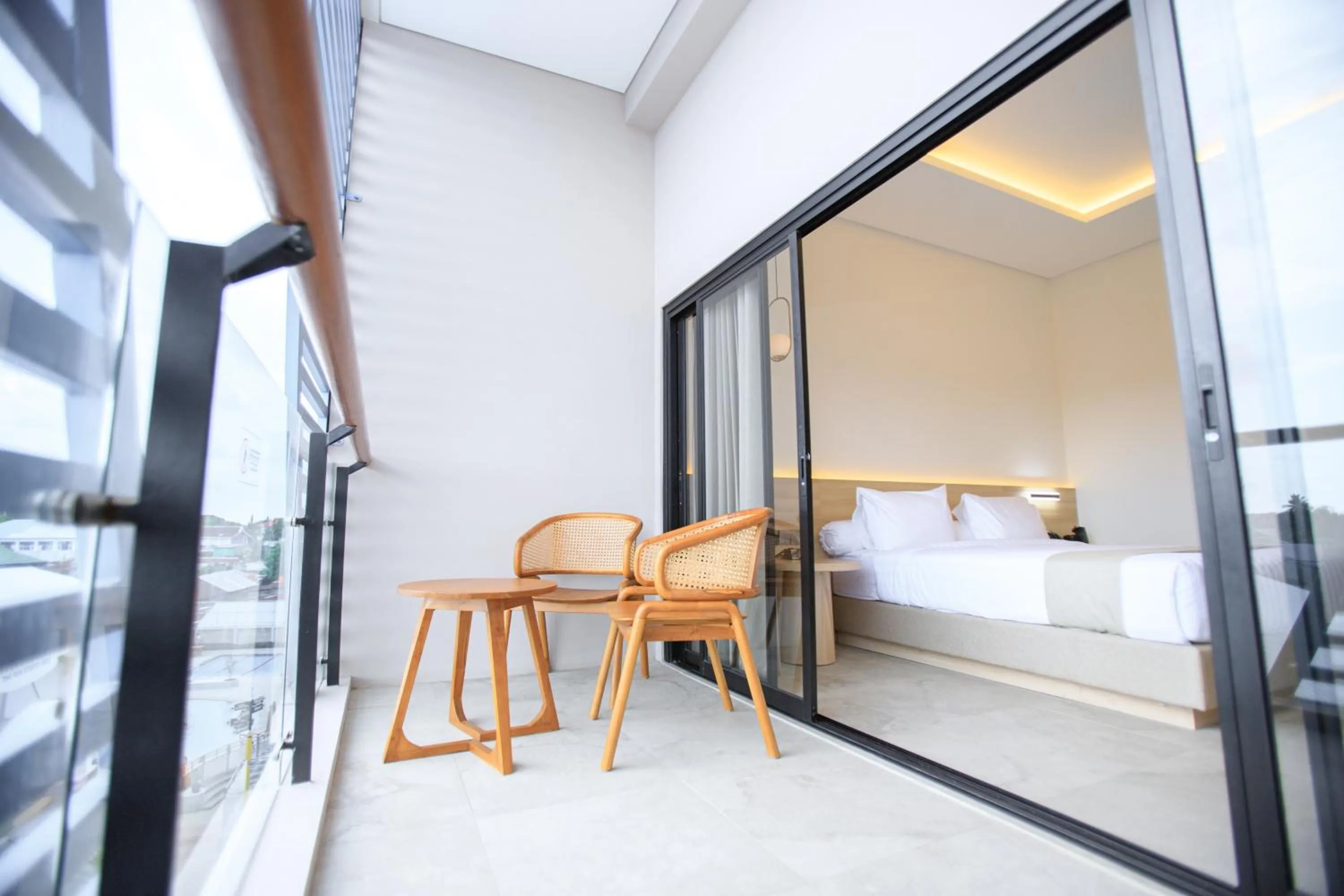 Balcony/Terrace, Bed in Two K Azana Style Hotel Bengkulu