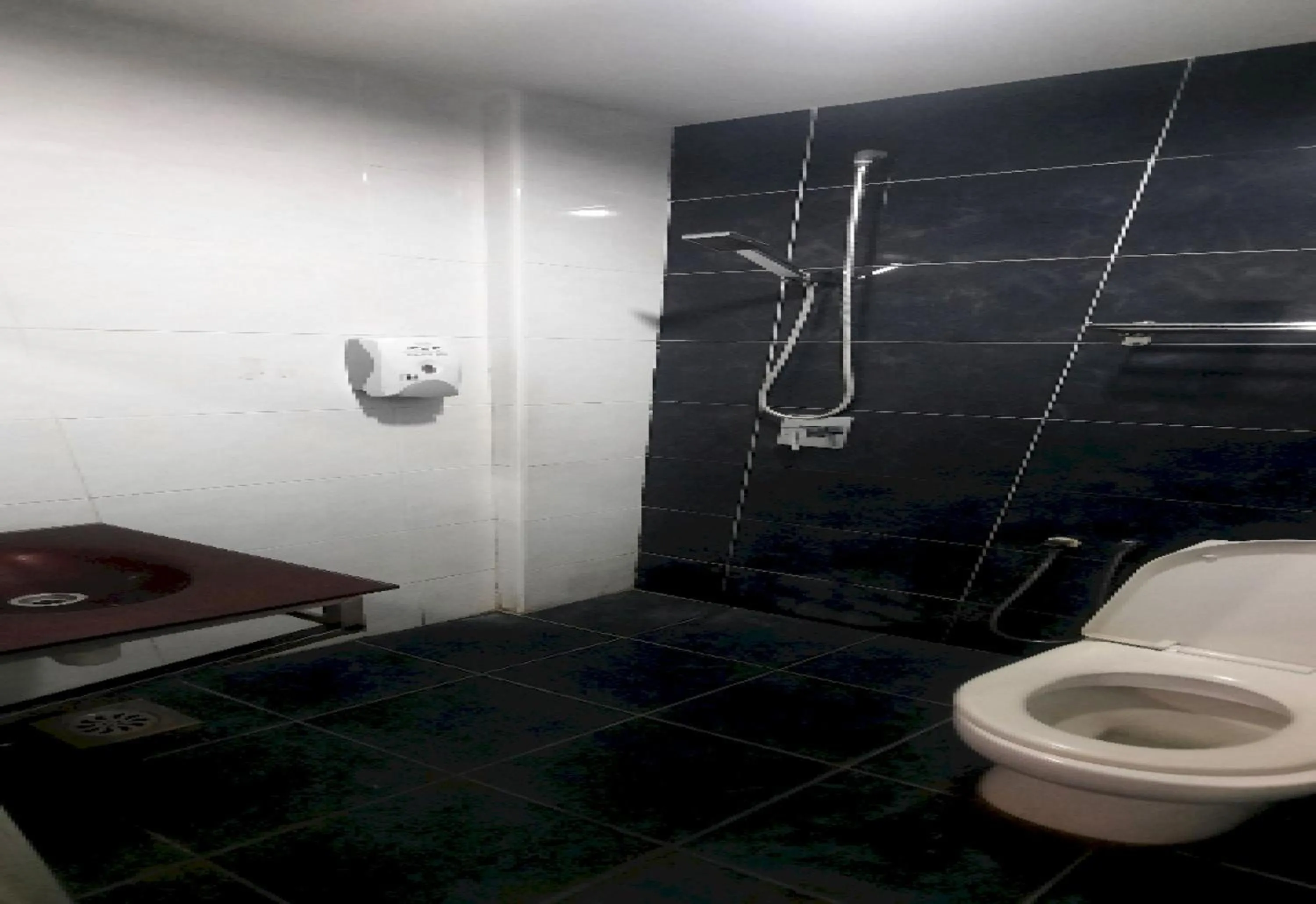 Bathroom in Super OYO 90724 Rg Hotel