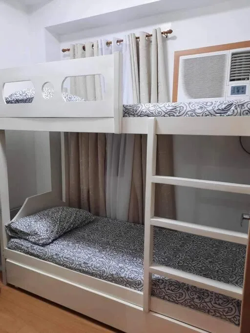 Bed in Happy Home Staycation