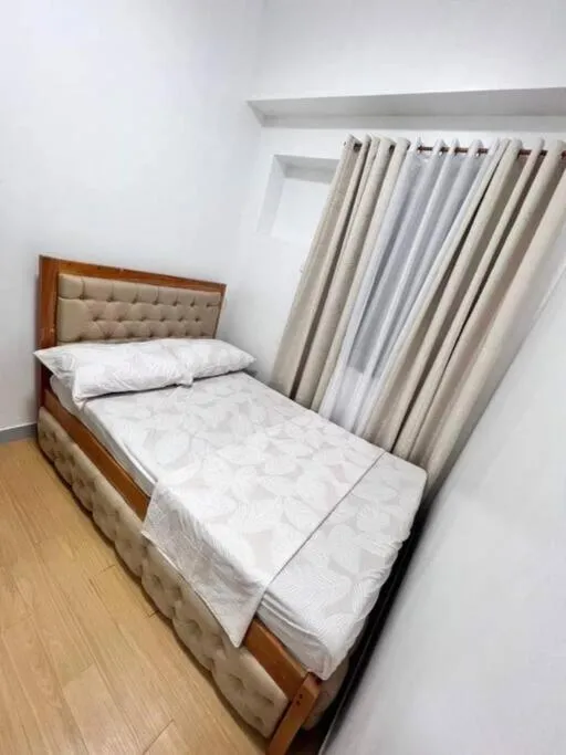 Bed in Happy Home Staycation