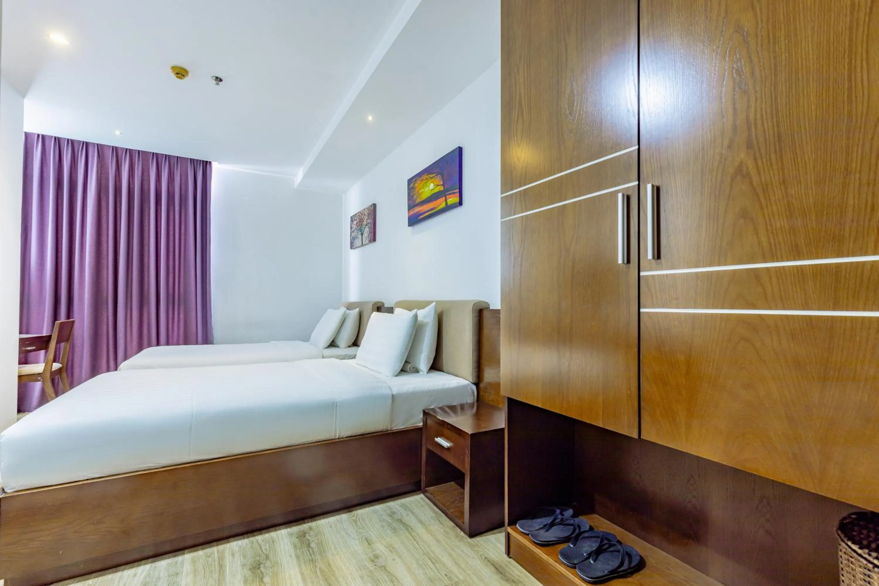 Bed in Golden Sun Apartment by New Sky Travel