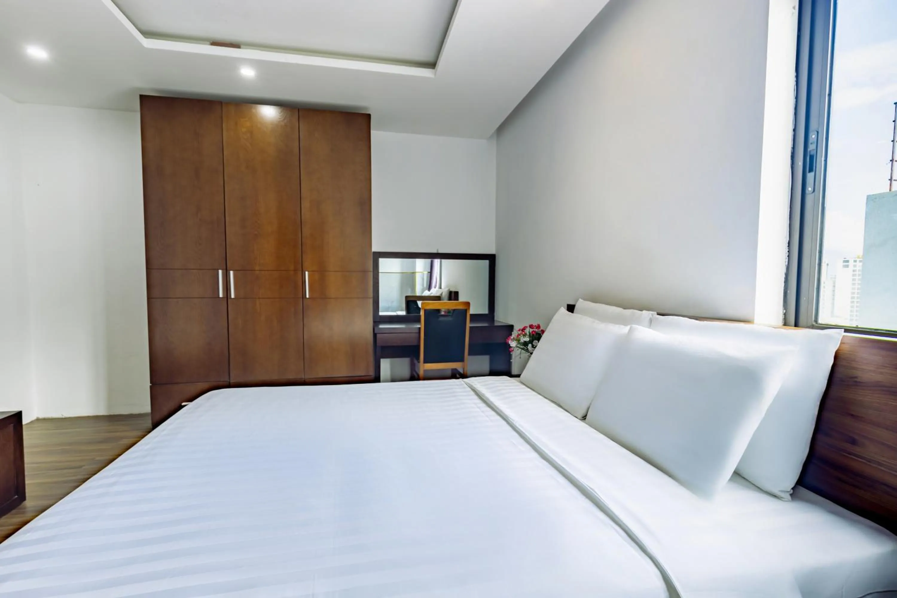 Bed in Golden Sun Apartment by New Sky Travel