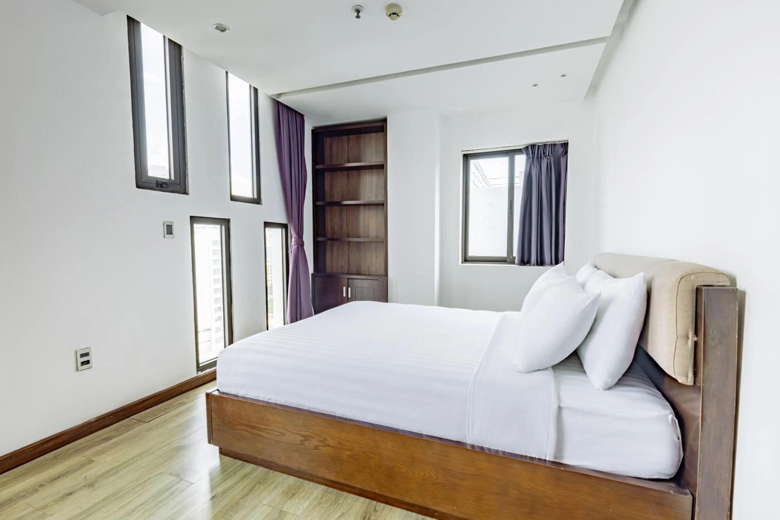 Bed in Golden Sun Apartment by New Sky Travel