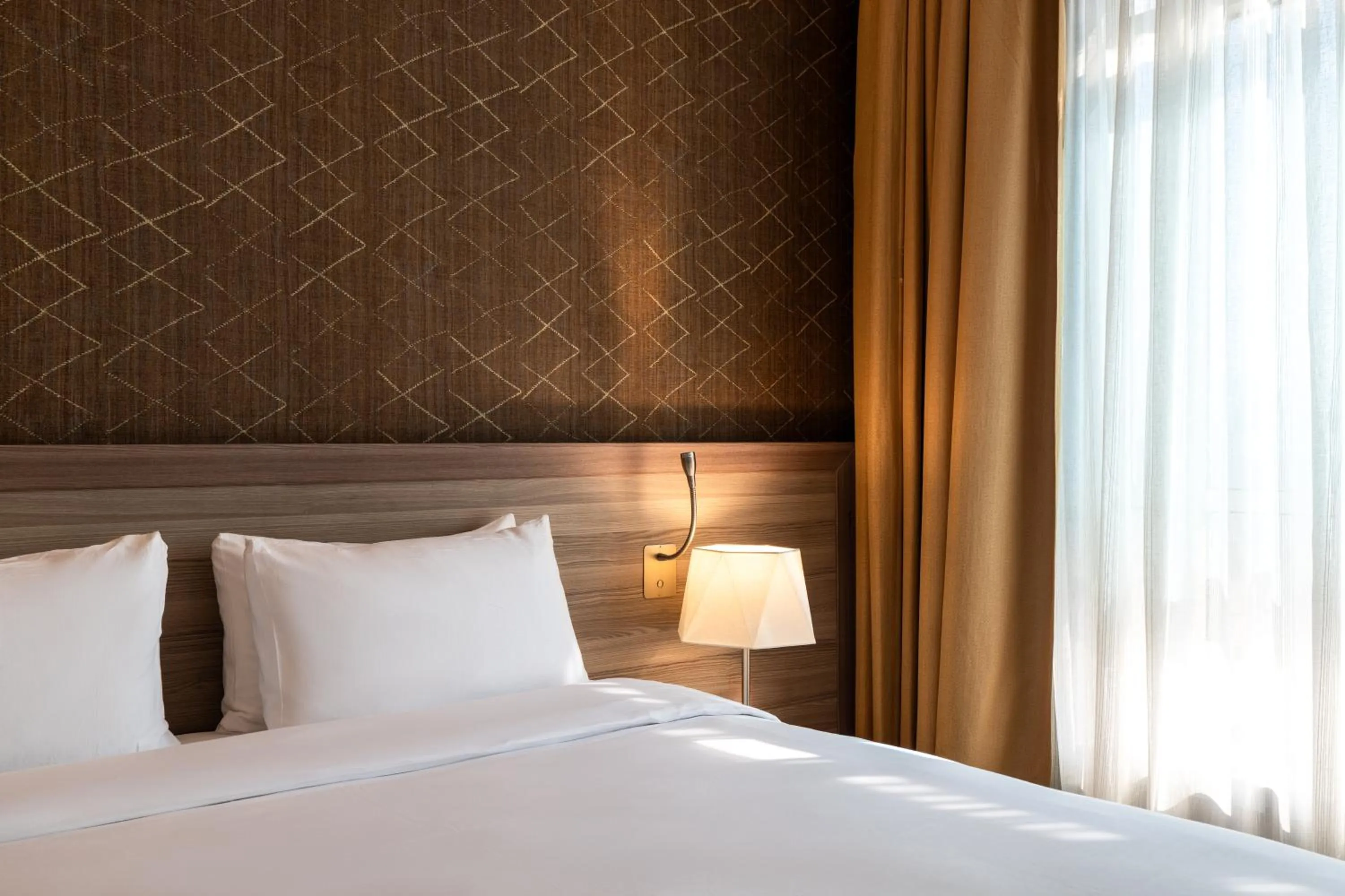 Bed in Mercure Makkah Aziziah