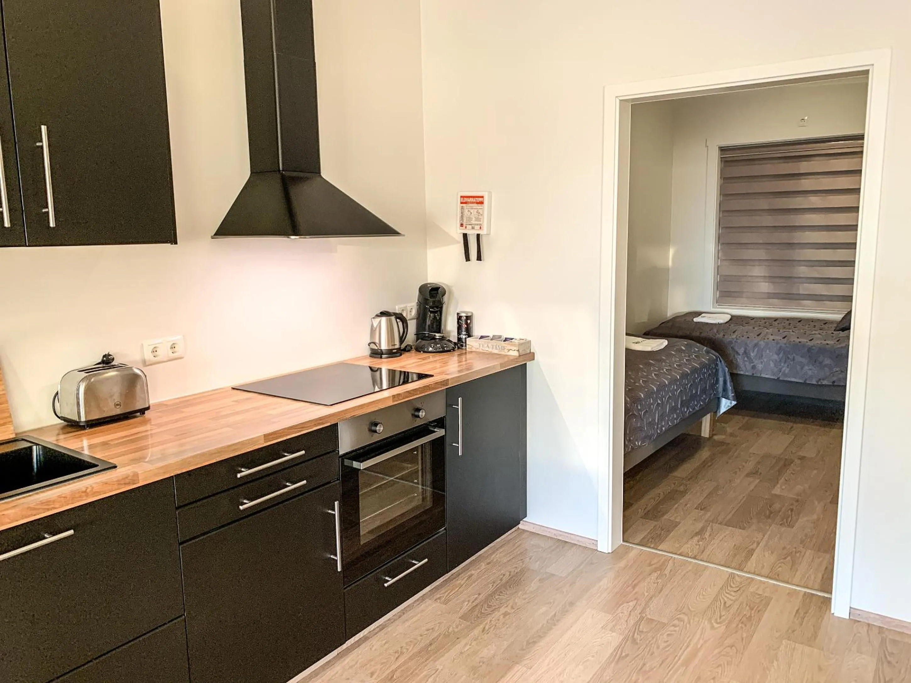 Kitchen or kitchenette, Bed in Bakki Apartments & Hostel