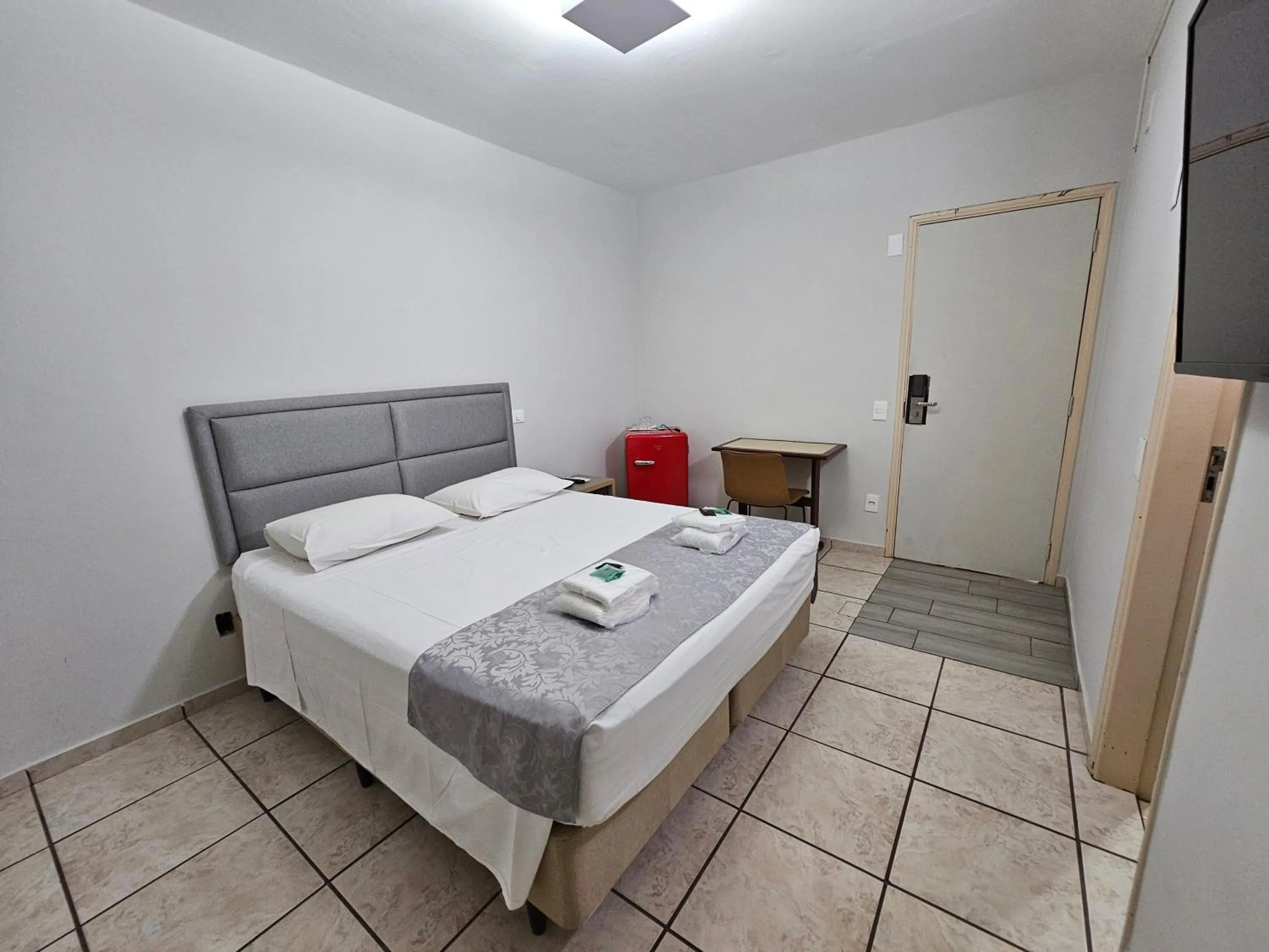 Bed in Optimum Plaza Hotel