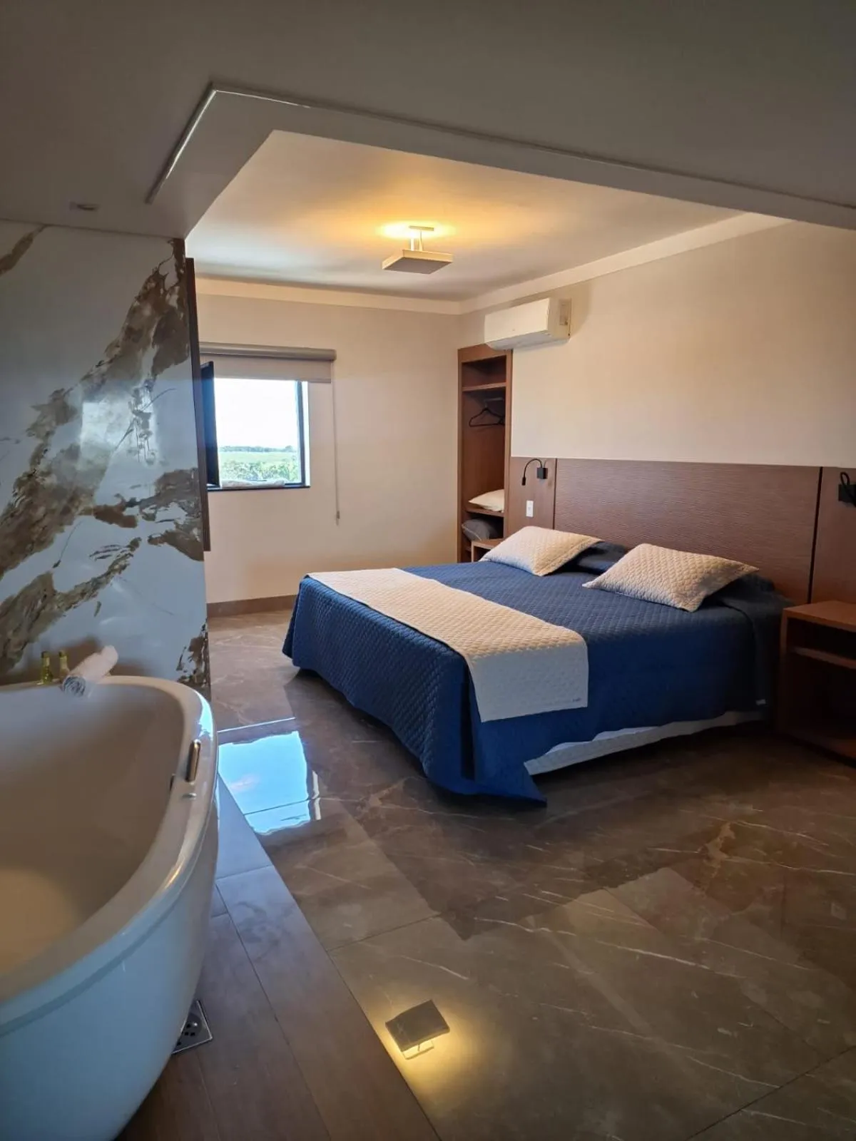 Bed in Optimum Plaza Hotel