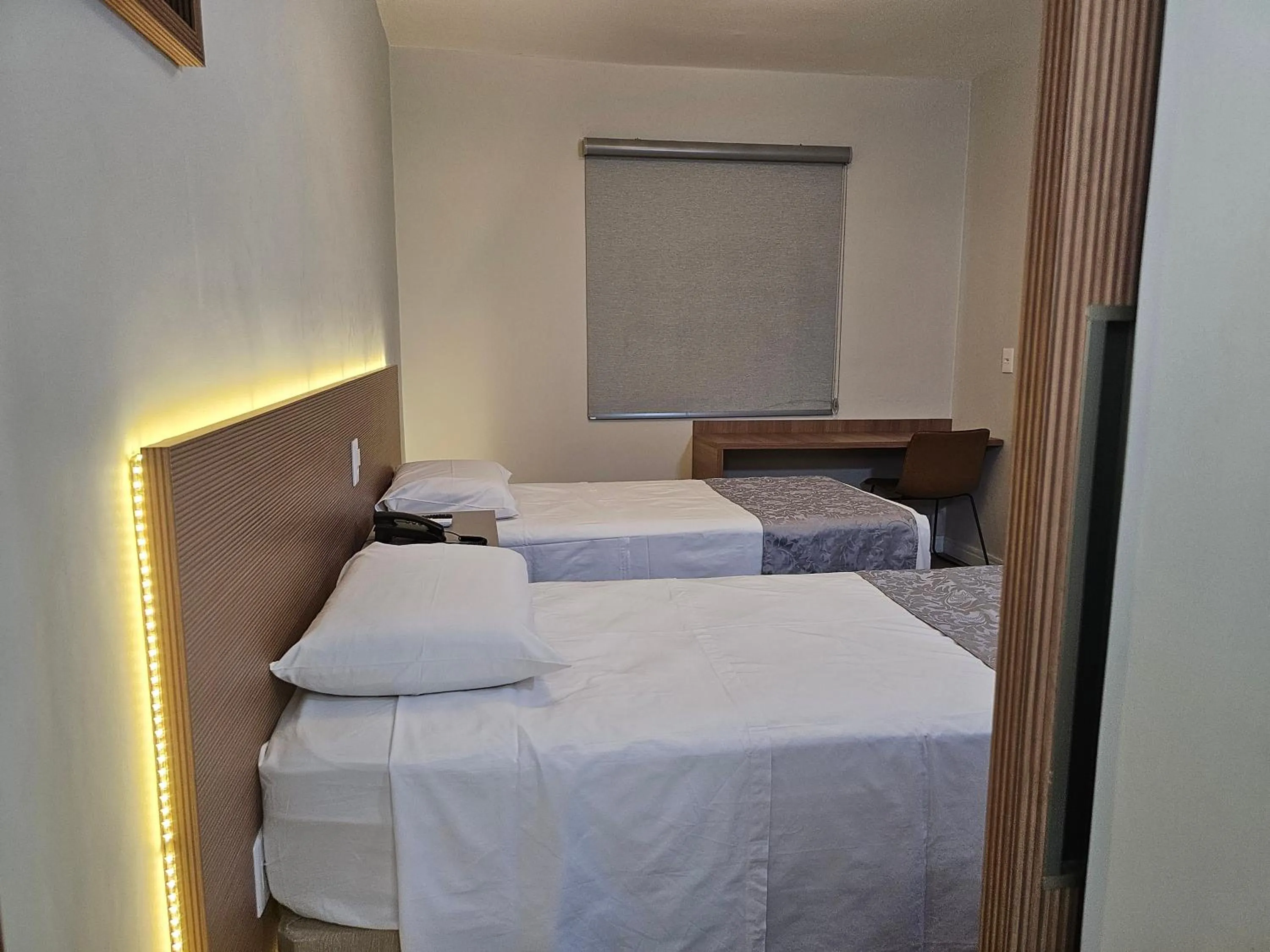 Bed in Optimum Plaza Hotel