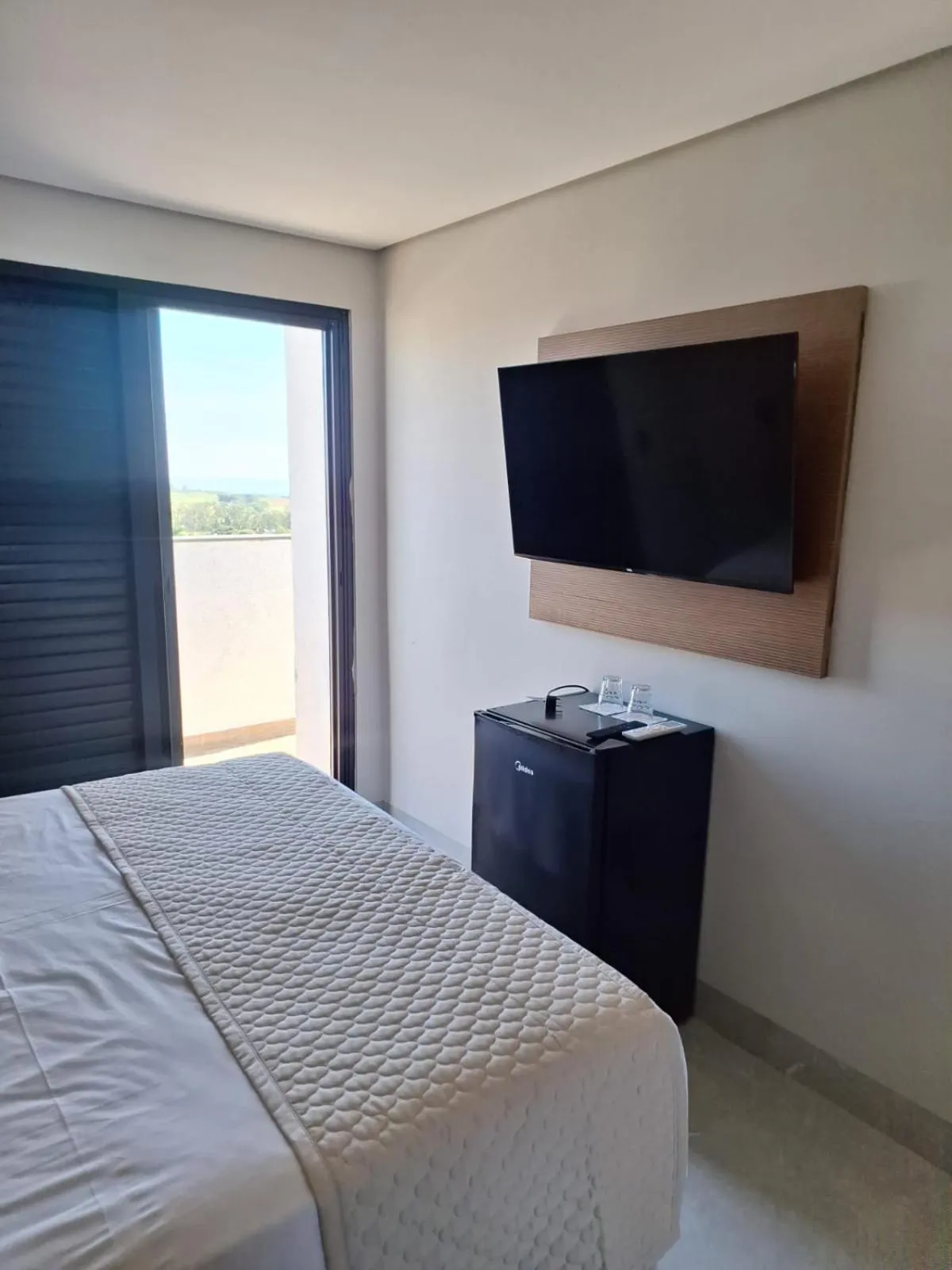 Bed in Optimum Plaza Hotel