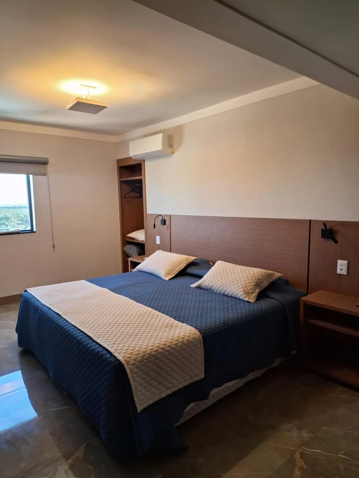 Bed in Optimum Plaza Hotel