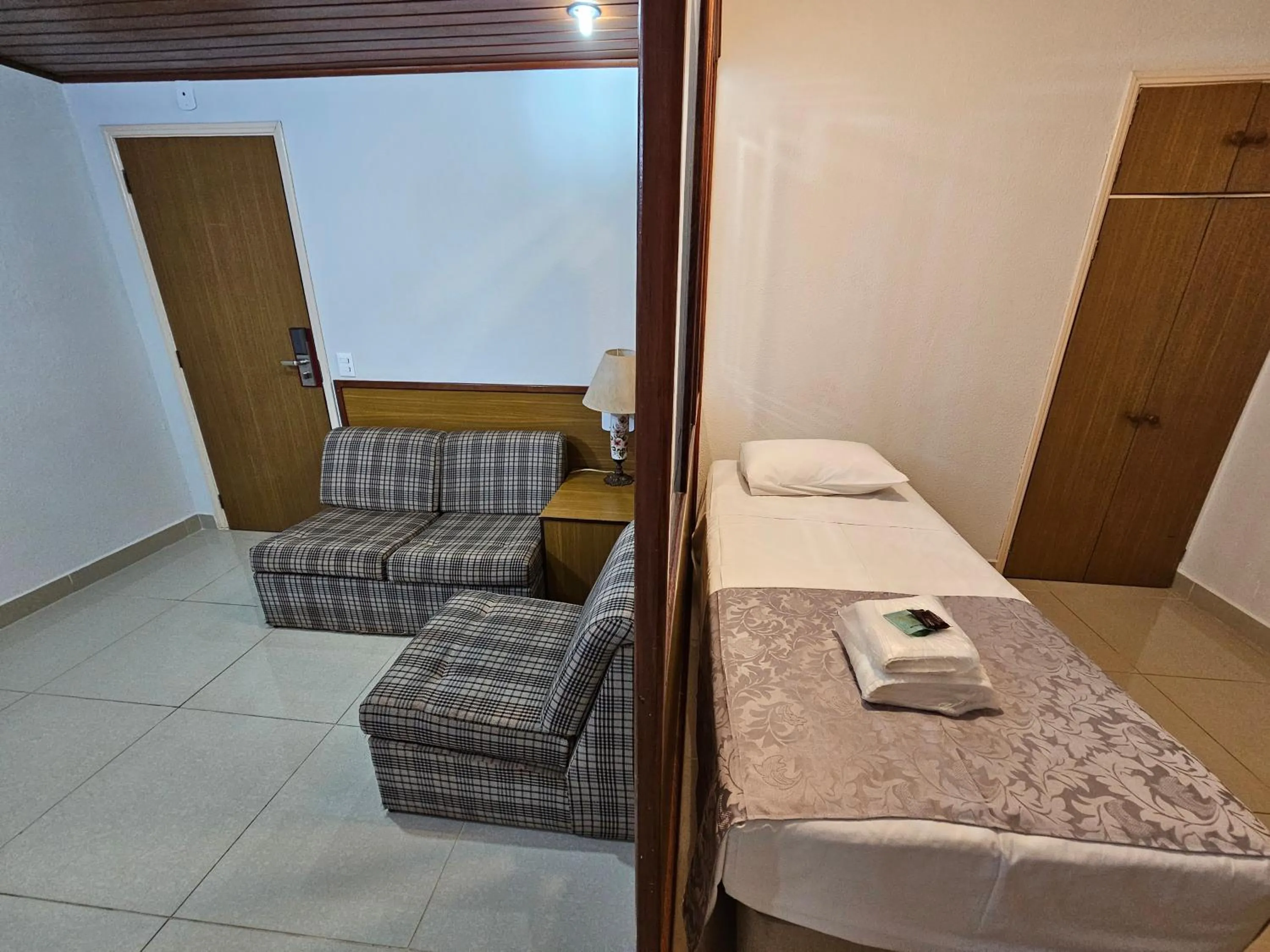 Bed in Optimum Plaza Hotel