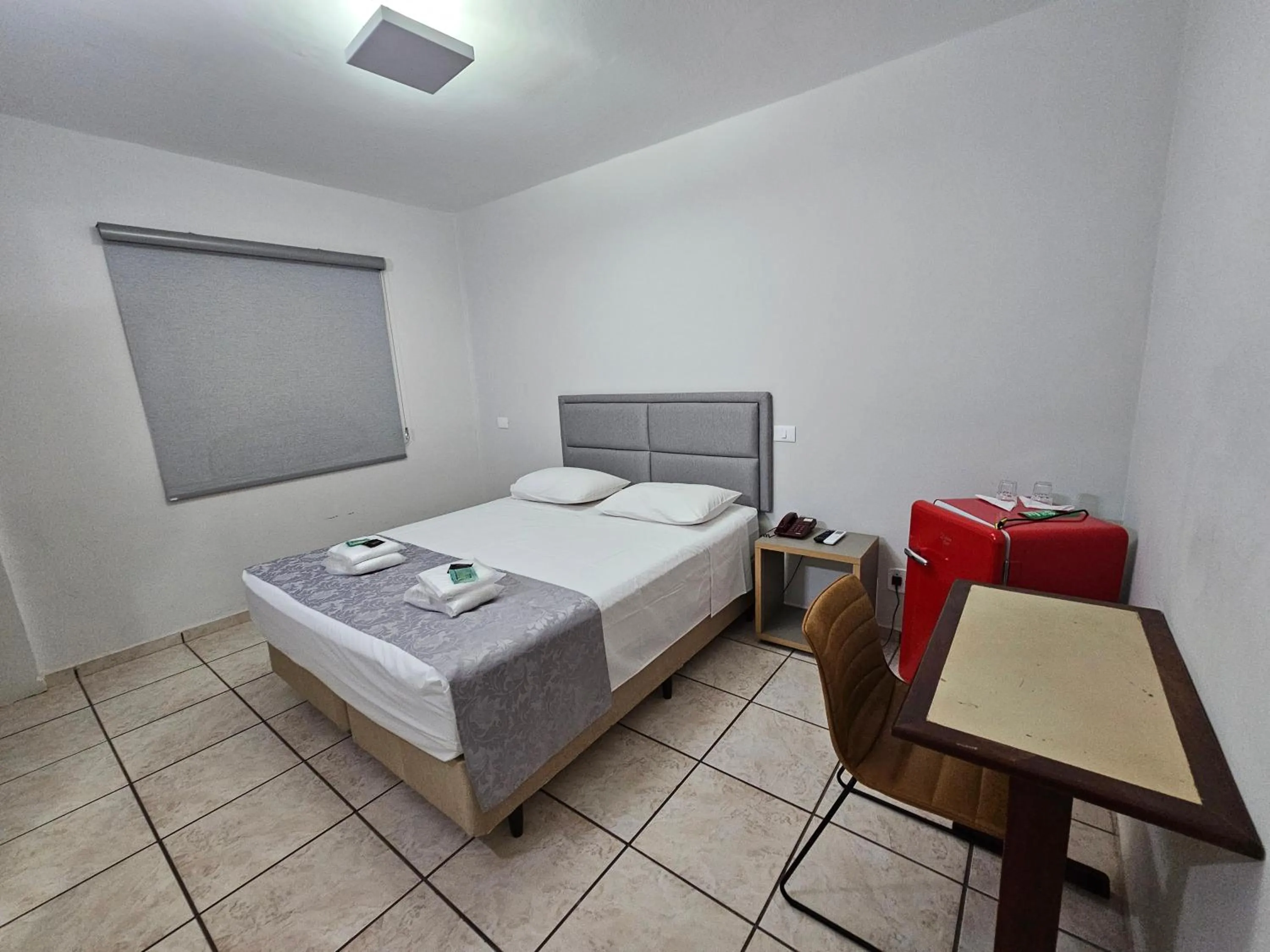 Bed in Optimum Plaza Hotel