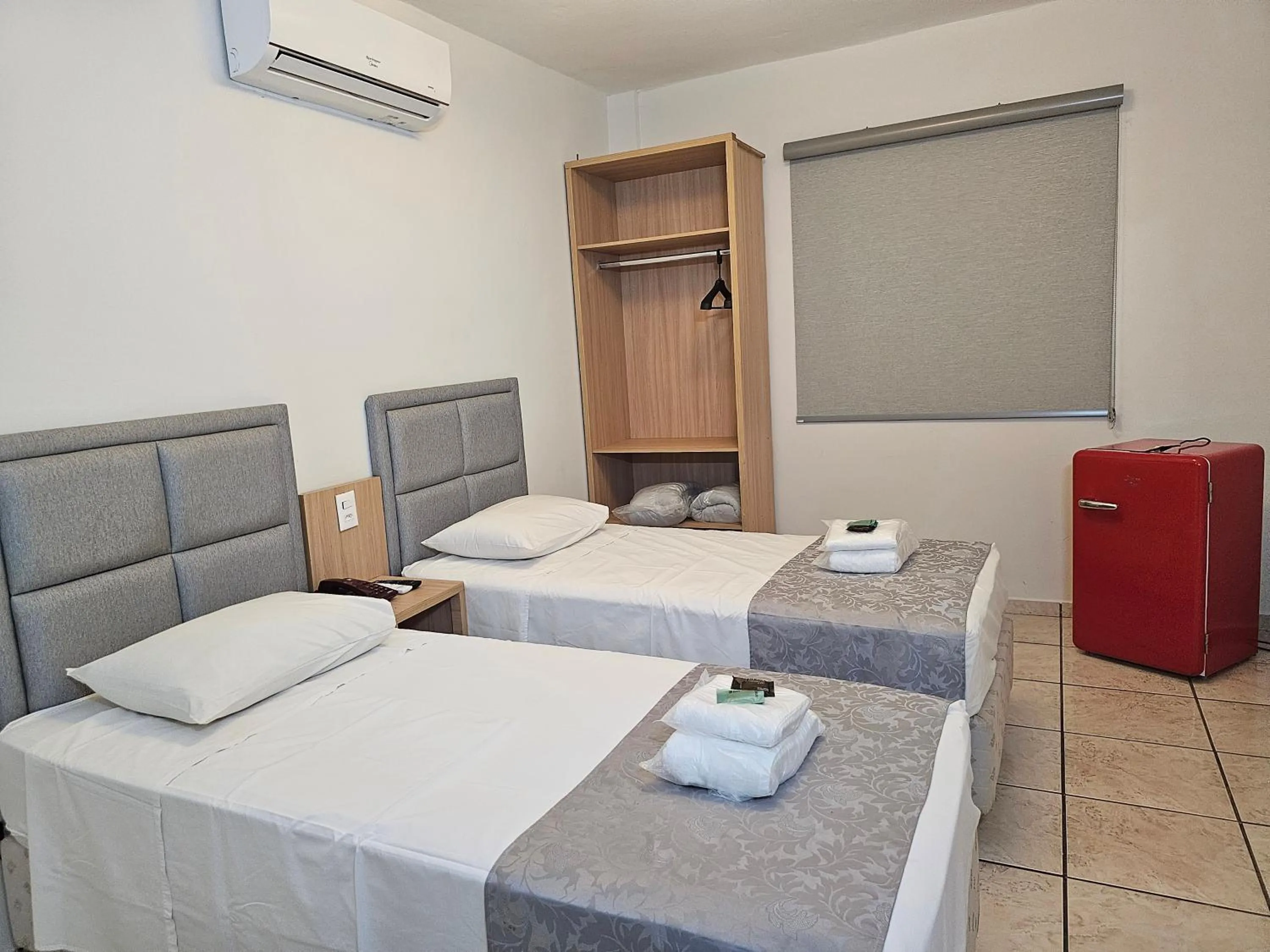 Bed in Optimum Plaza Hotel