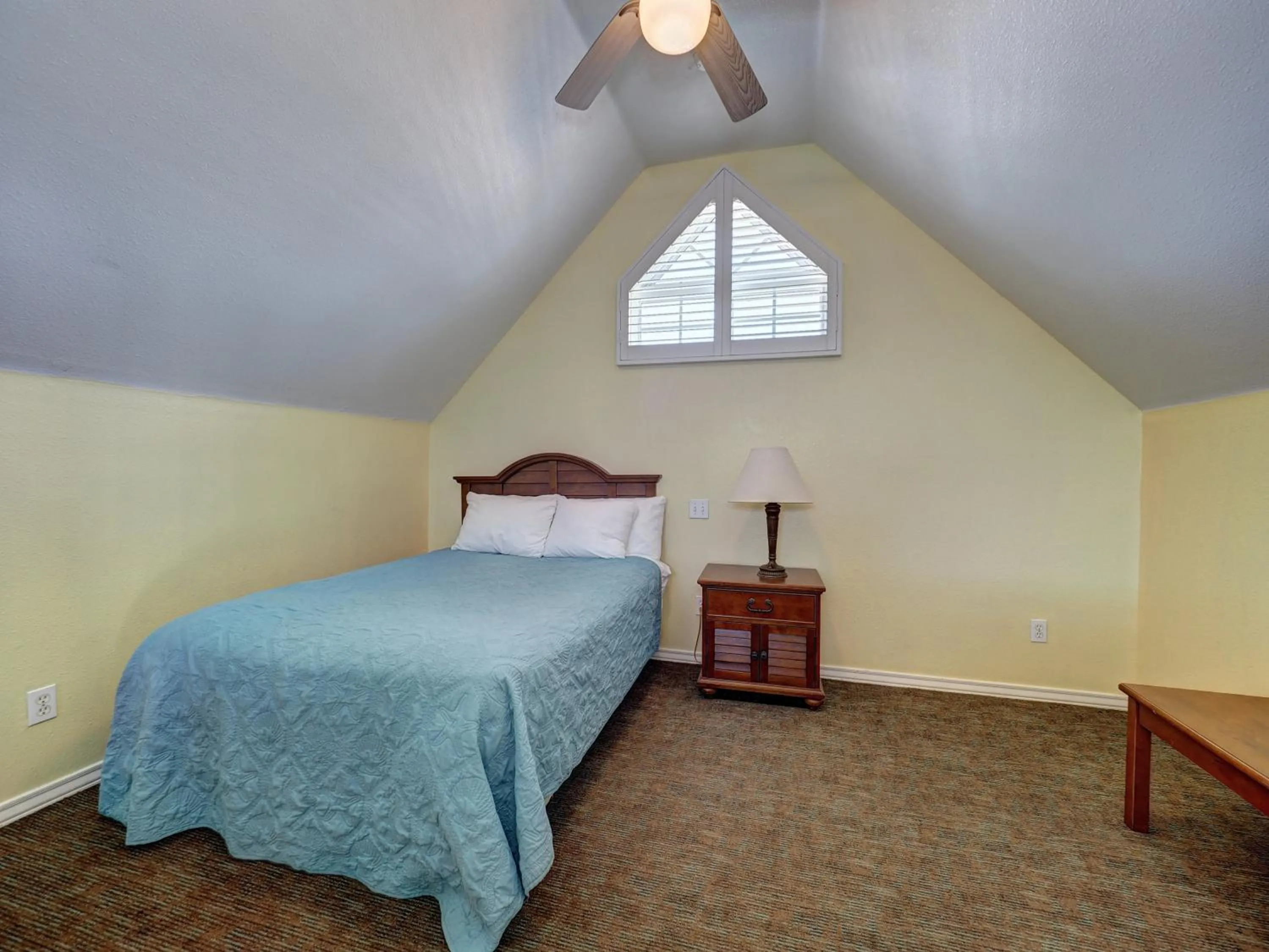 Bed in Seashell Village Resort near the beach with kitchens