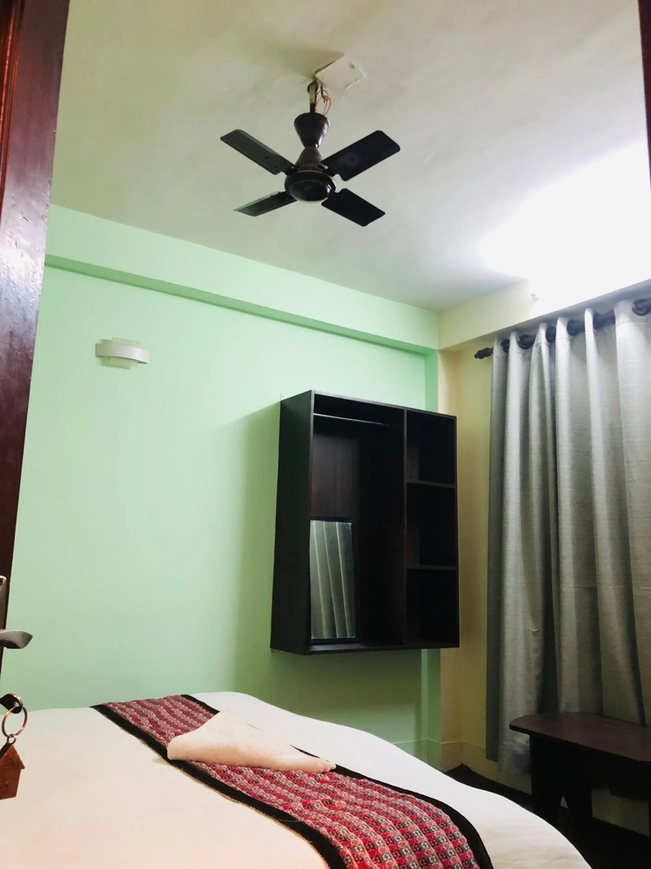 fireplace, Bed in Yeti Cozy Hotel