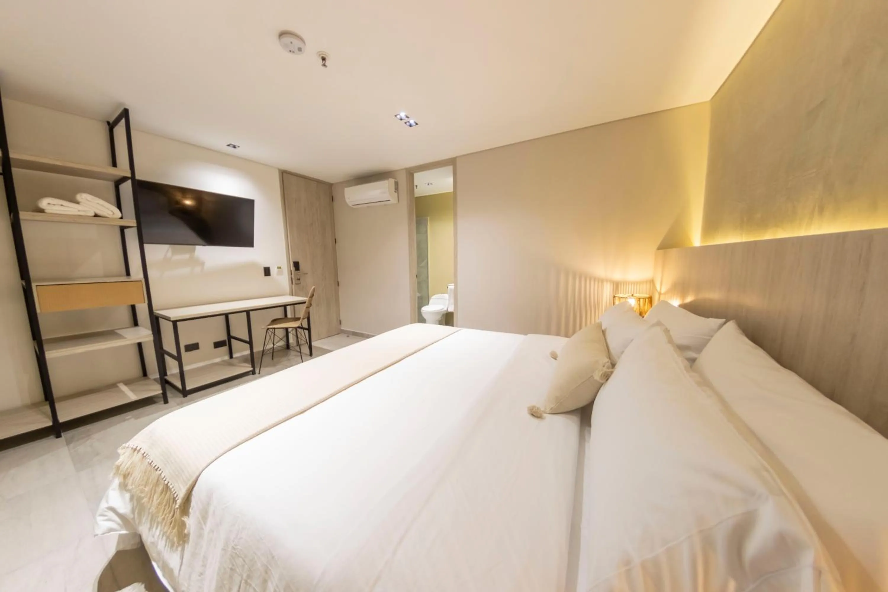 Bed in Sonata 44 Hotel Laureles