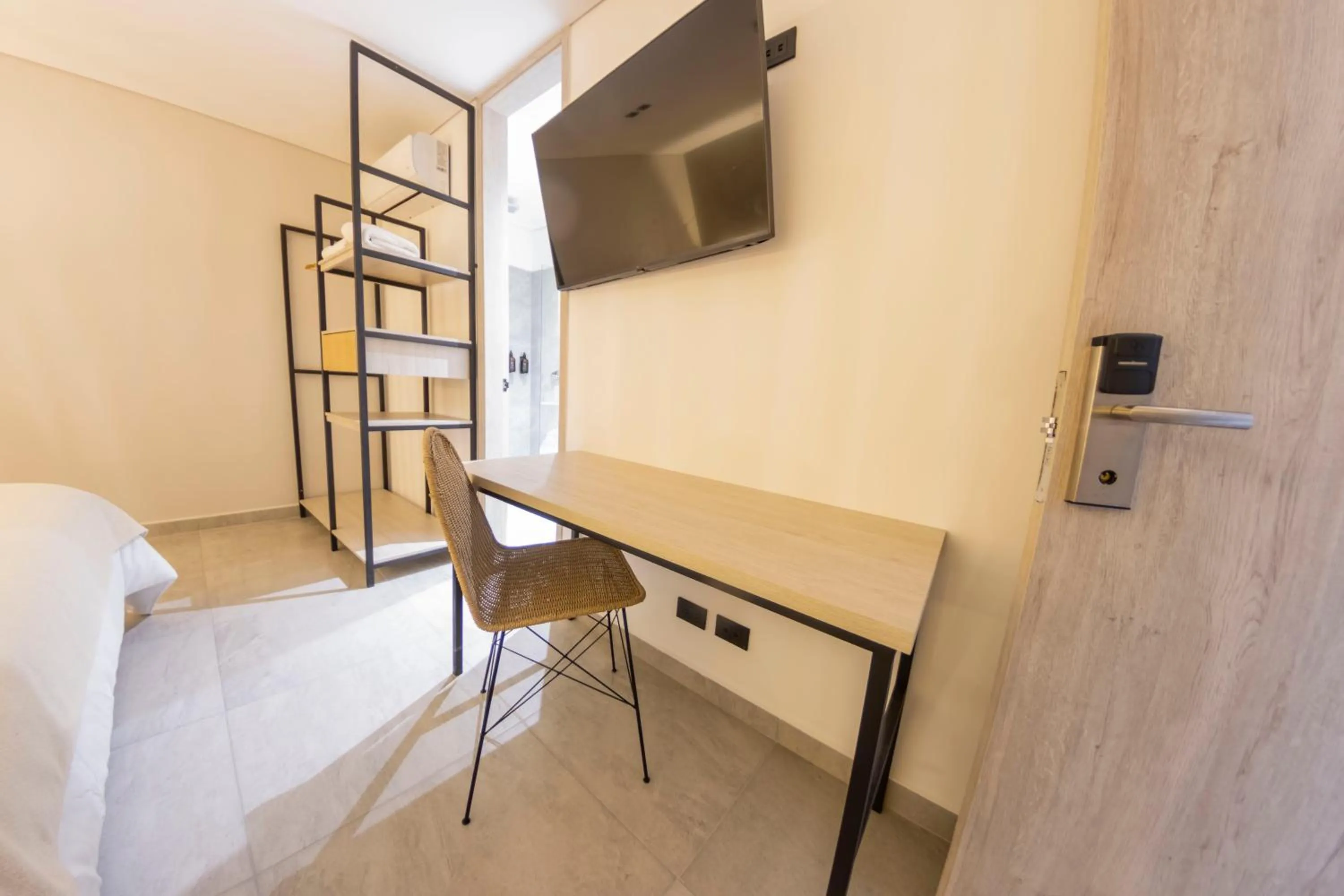 Bed in Sonata 44 Hotel Laureles